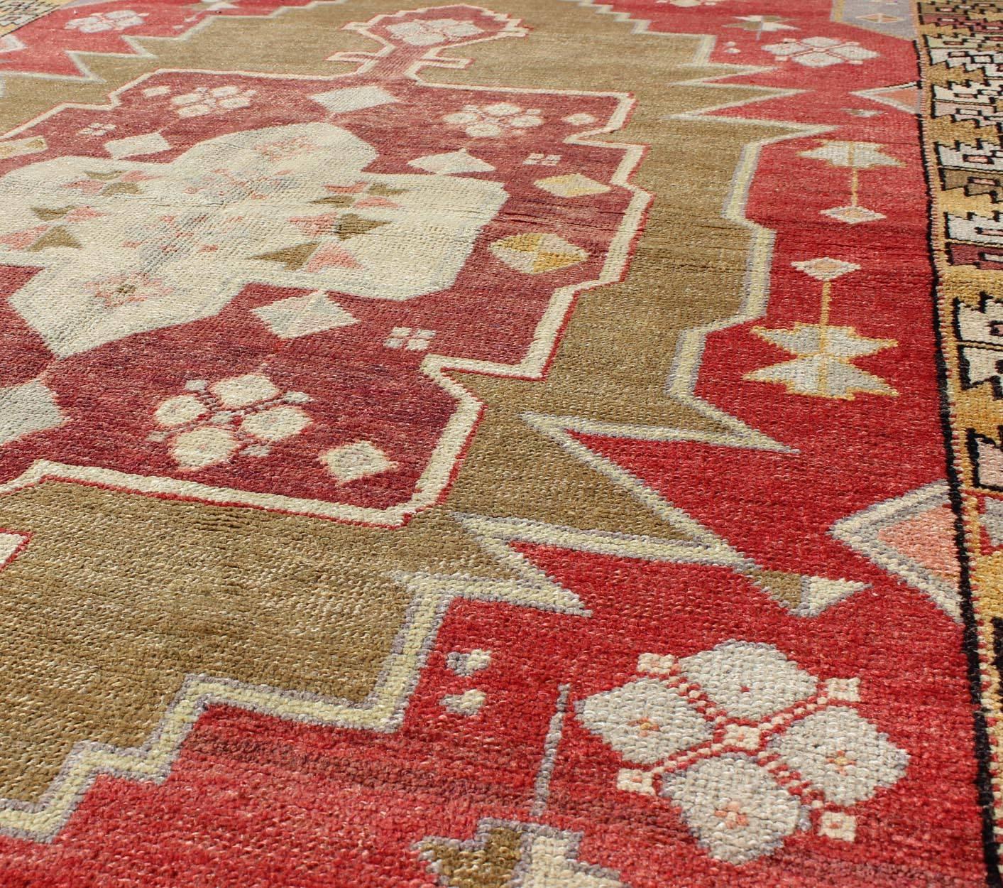 20th Century Unique Vintage Turkish Oushak Rug with Geometric Medallion in Red, Green, Yellow For Sale