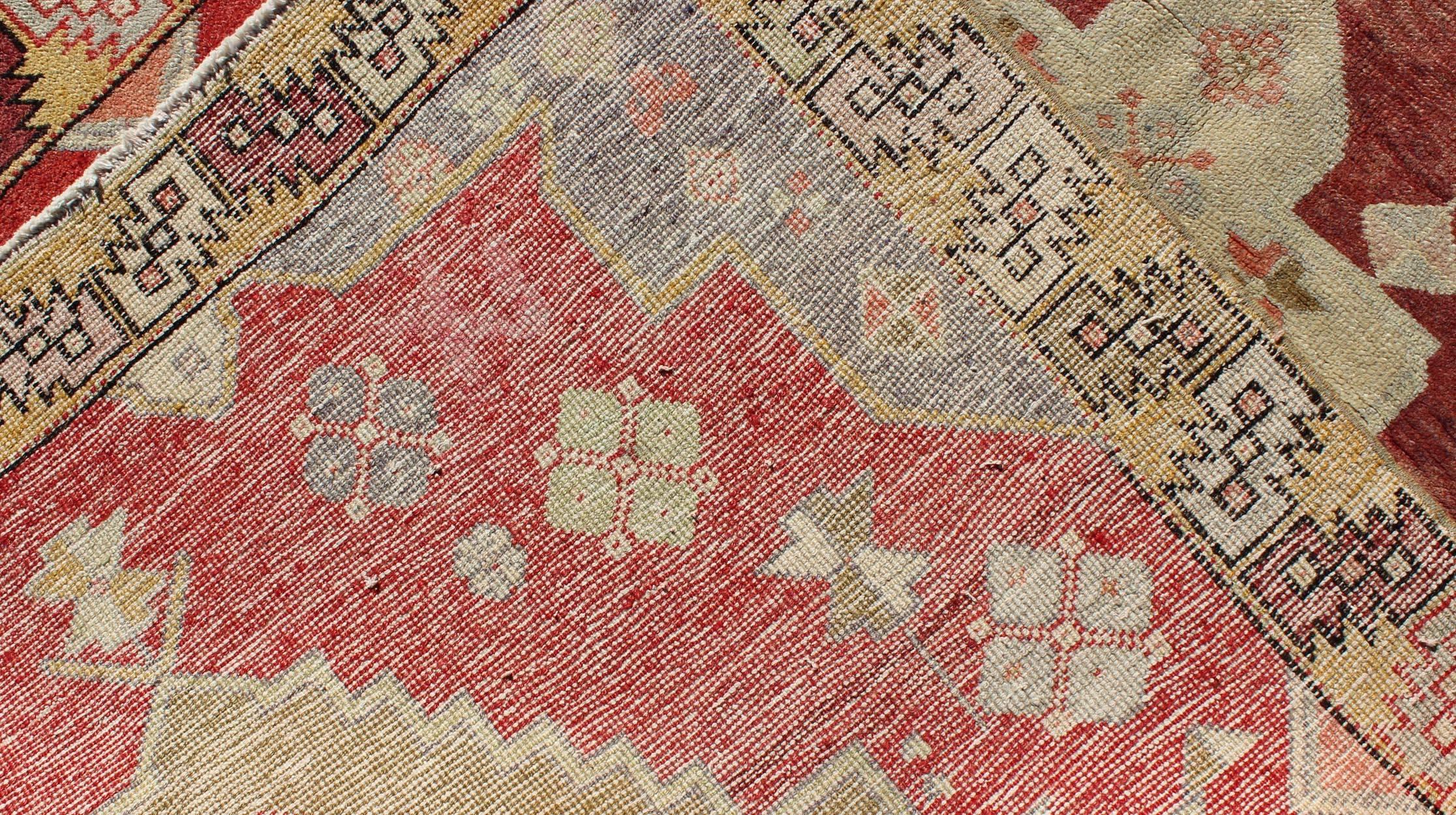 Wool Unique Vintage Turkish Oushak Rug with Geometric Medallion in Red, Green, Yellow For Sale