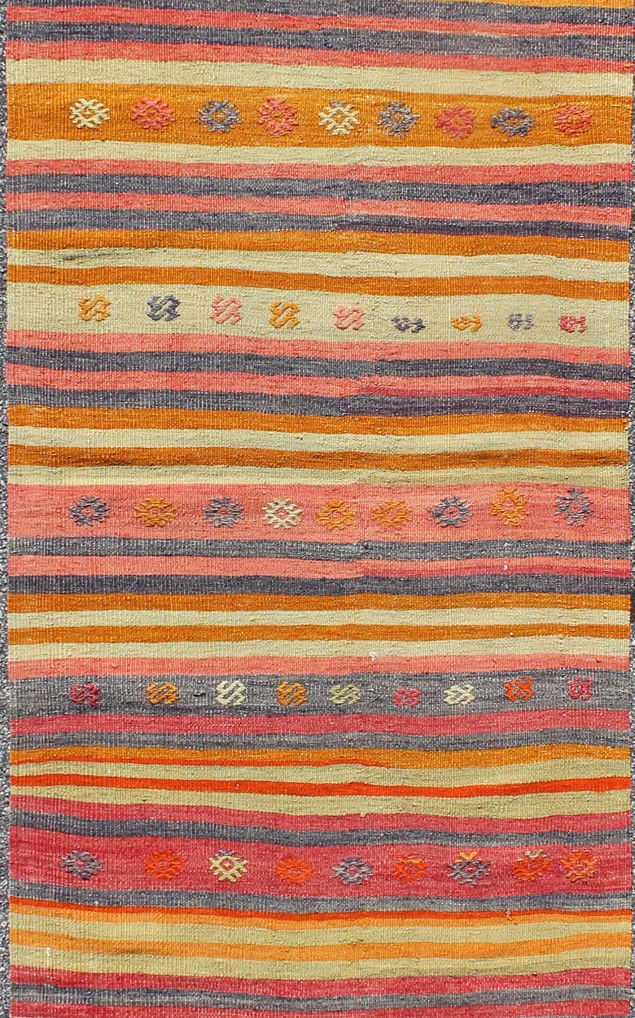 Hand-Woven Vintage Turkish Oushak Rug with Geometric Tribal Designs and Colorful Stripes For Sale