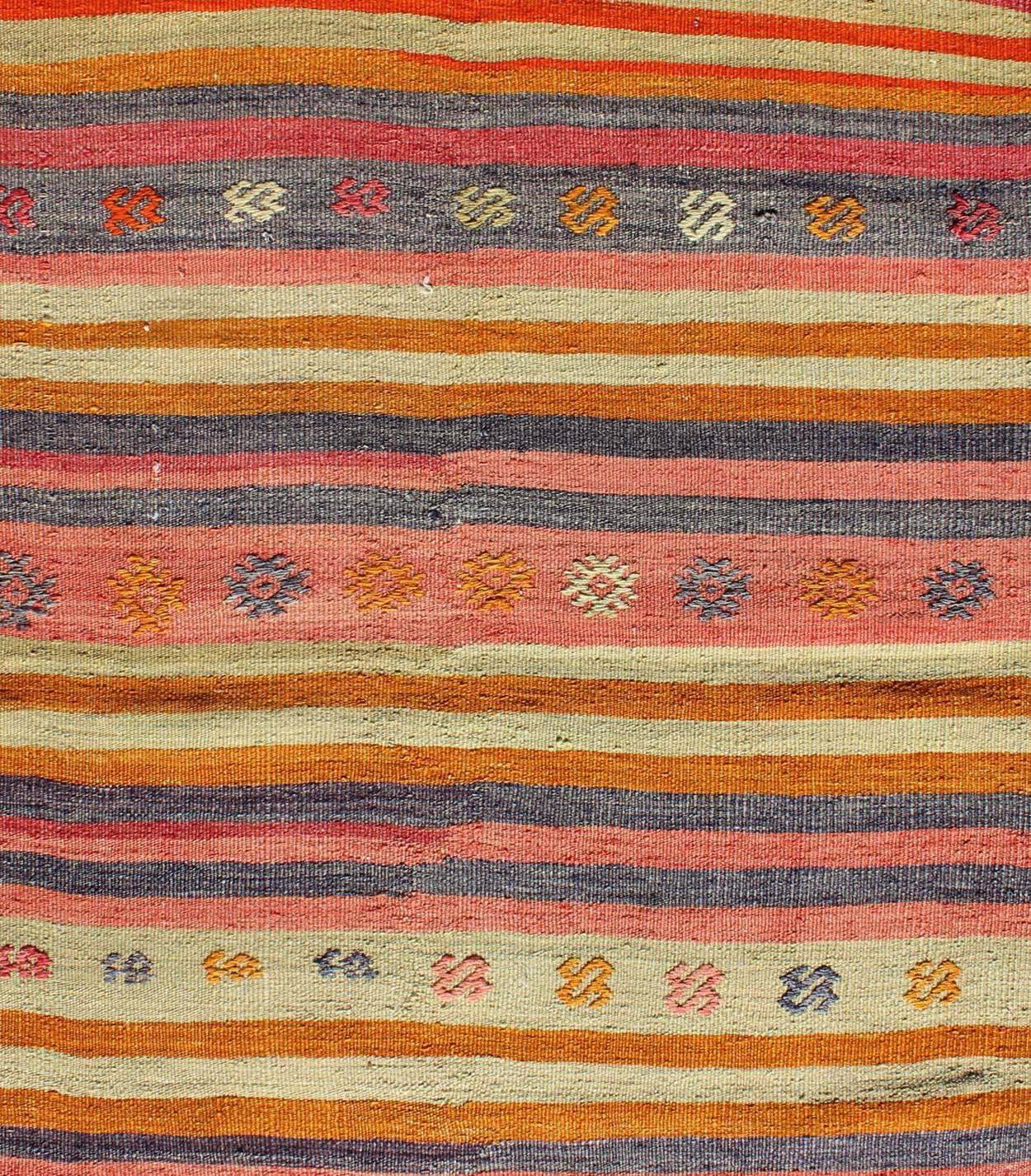 20th Century Vintage Turkish Oushak Rug with Geometric Tribal Designs and Colorful Stripes For Sale