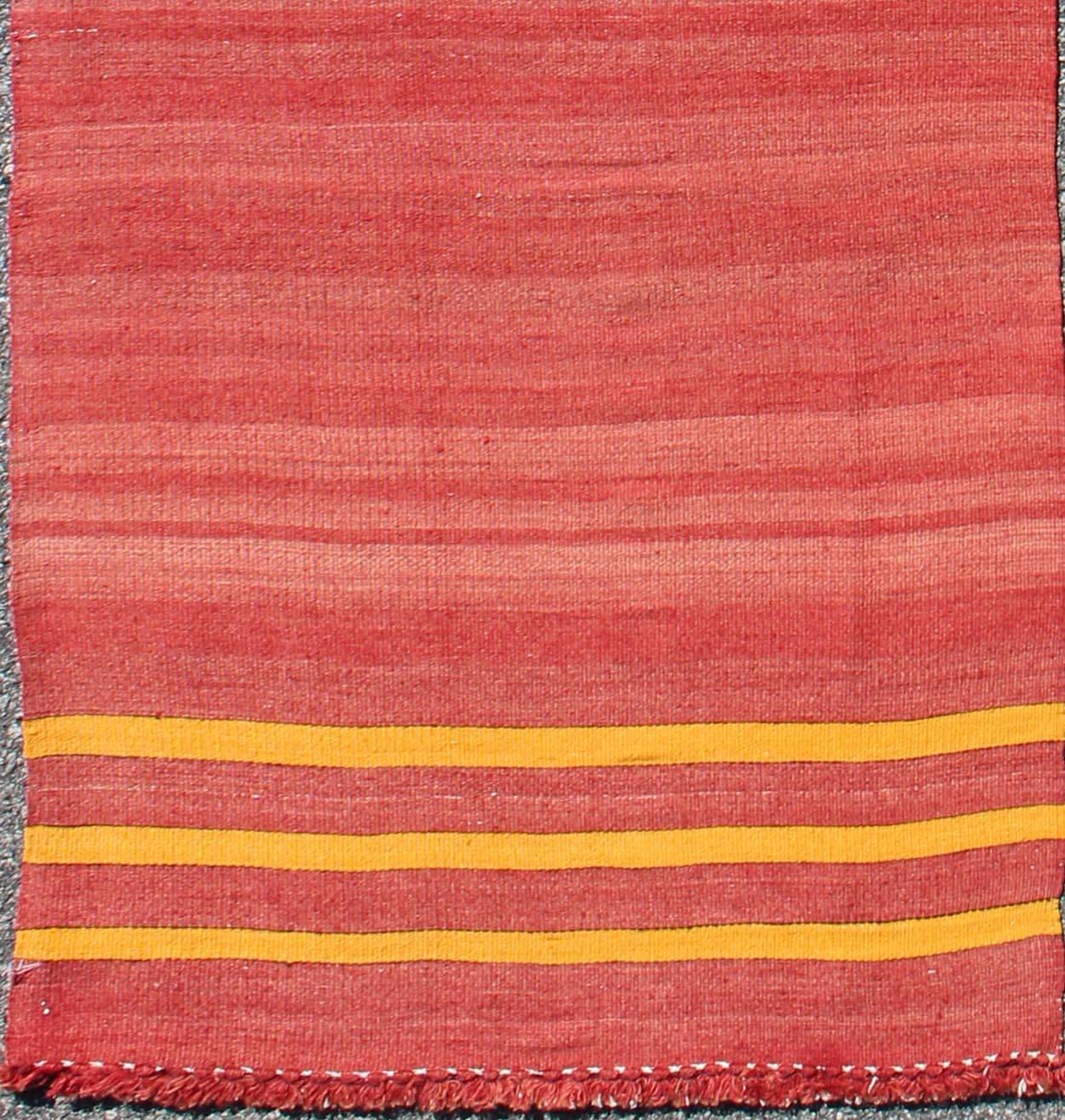 Red, yellow, and salmon pink striped midcentury vintage Turkish Kilim rug, rug ned-143, country of origin / type: Turkey / Kilim, circa mid-20th century

Featuring a repeating horizontal stripe design, this unique midcentury Kilim rug showcases an