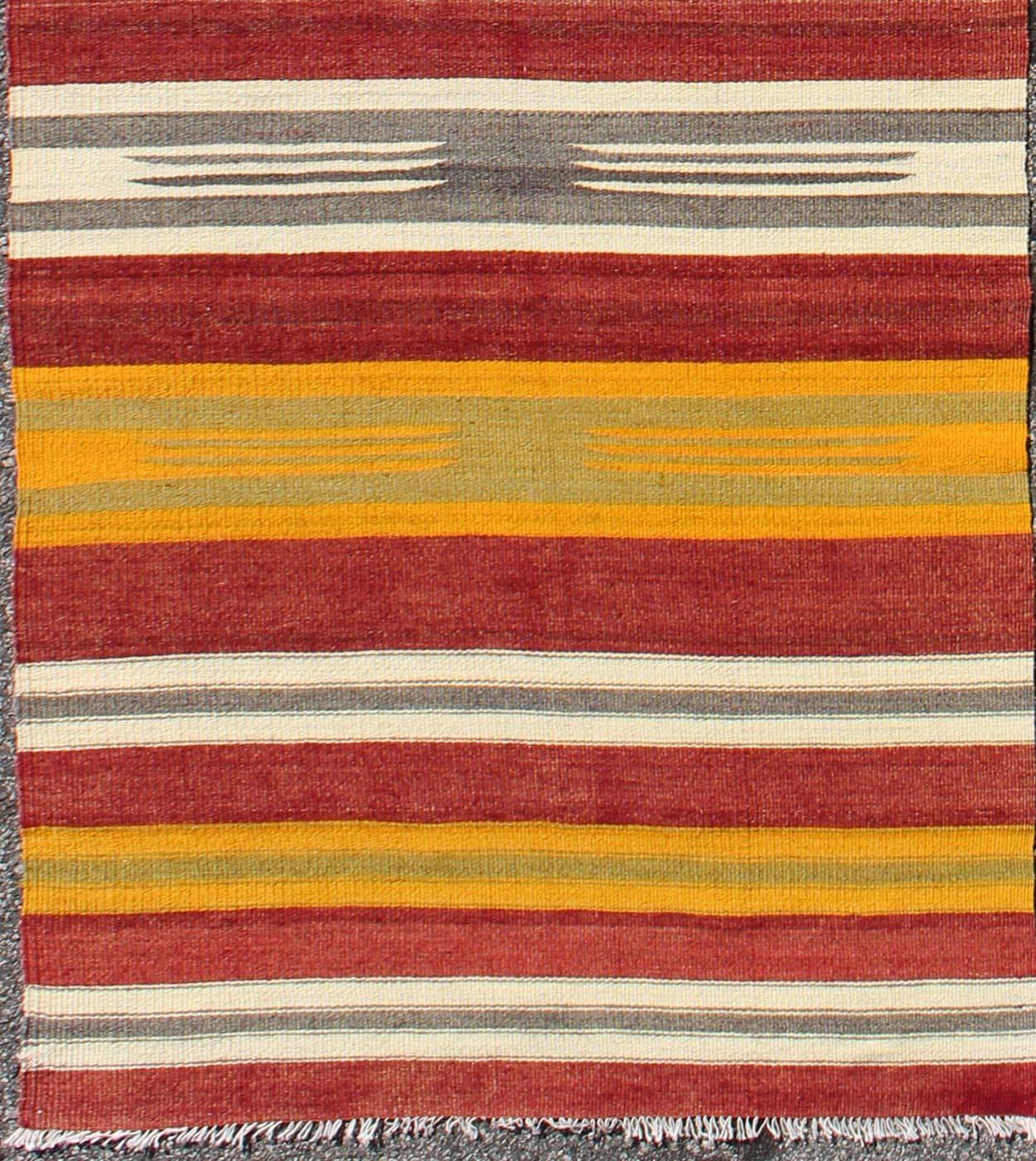 Vintage Turkish Kilim runner with stripes in red, green, yellow, ivory, gray, rug ned-145, country of origin / type: Turkey / Kilim, circa mid-20th century.

Woven during the mid-20th century in Turkey, this designer Kilim is decorated with a