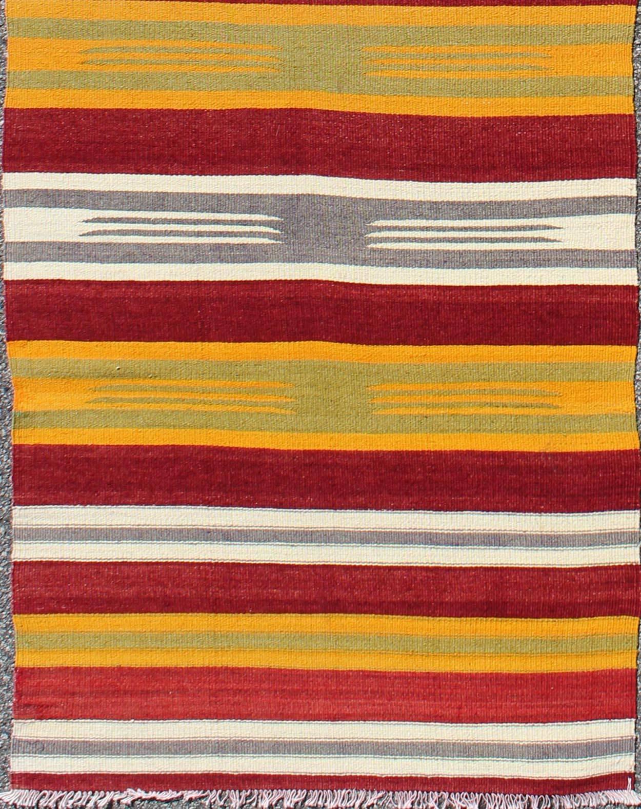 Turkish Kilim runner with stripes in red, green, yellow, ivory and gray, rug ned-146, country of origin / type: Turkey / Kilim, circa mid-20th century

Woven during the mid-20th century in Turkey, this designer Kilim is decorated with a horizontal
