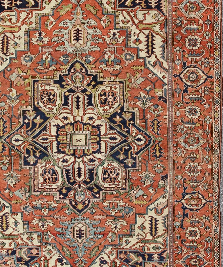 Antique Persian Serapi Rug with Bold Medallion in Orange, Navy Blue and