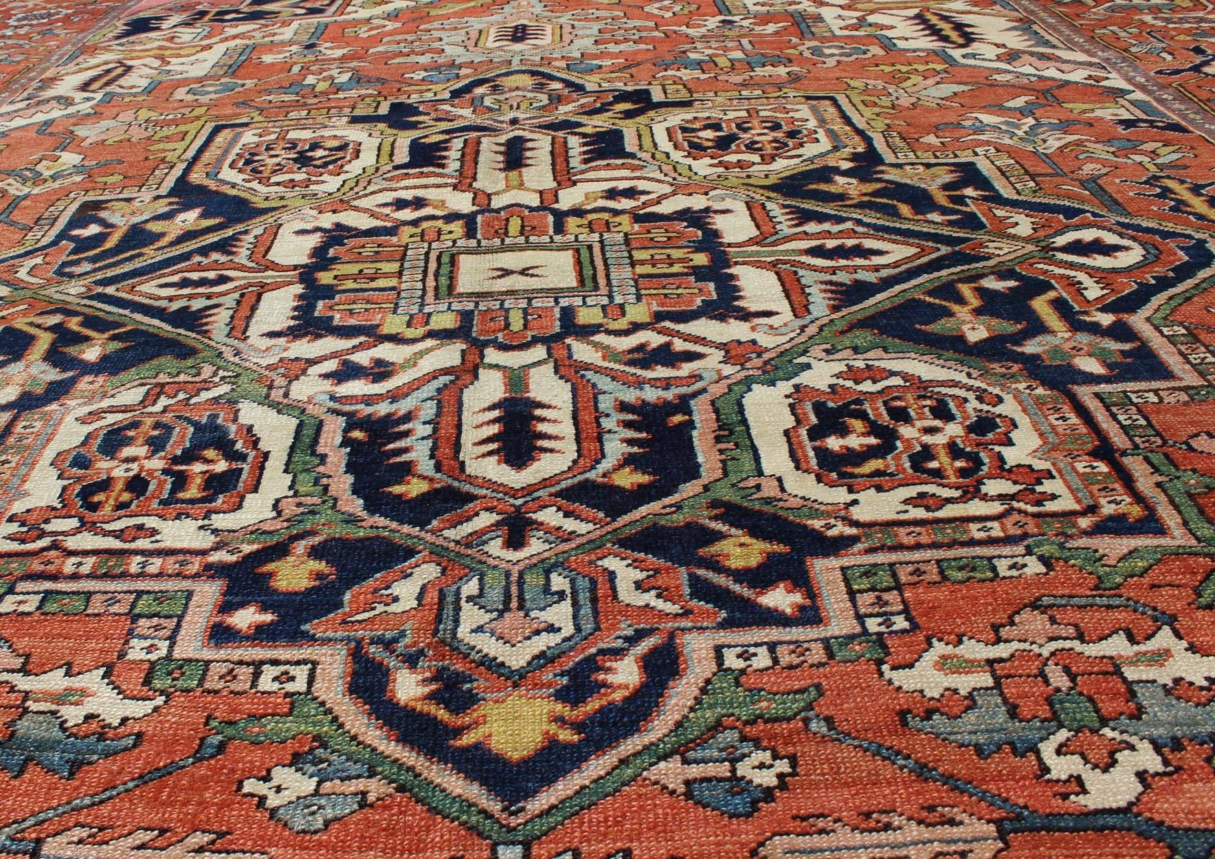 Antique Persian Serapi Rug with Bold Medallion in Orange, Navy Blue and Green In Excellent Condition In Atlanta, GA