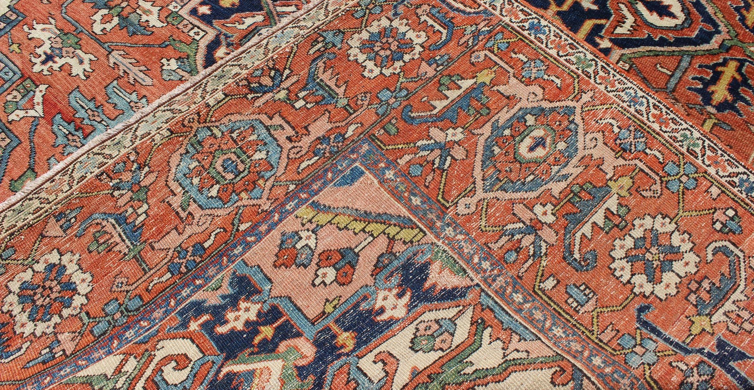 Early 20th Century Antique Persian Serapi Rug with Bold Medallion in Orange, Navy Blue and Green