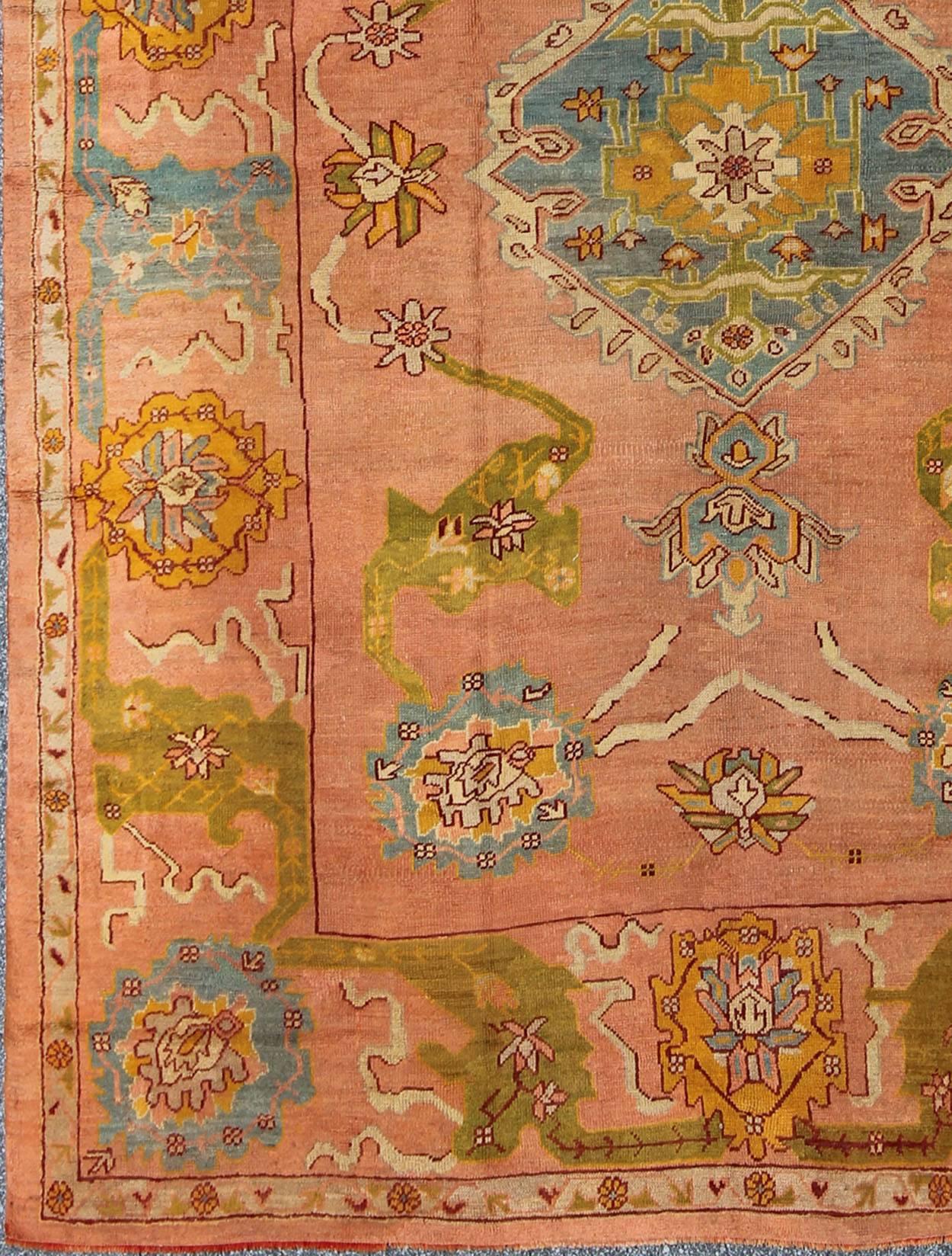 The richly opulent colors and unusual design of this antique Oushak carpet transport you to the romantic era when Kubla Khan traveled the Far East in search of exotic treasures. Beautiful Turkish late 19th Century craftsmanship and inspiring