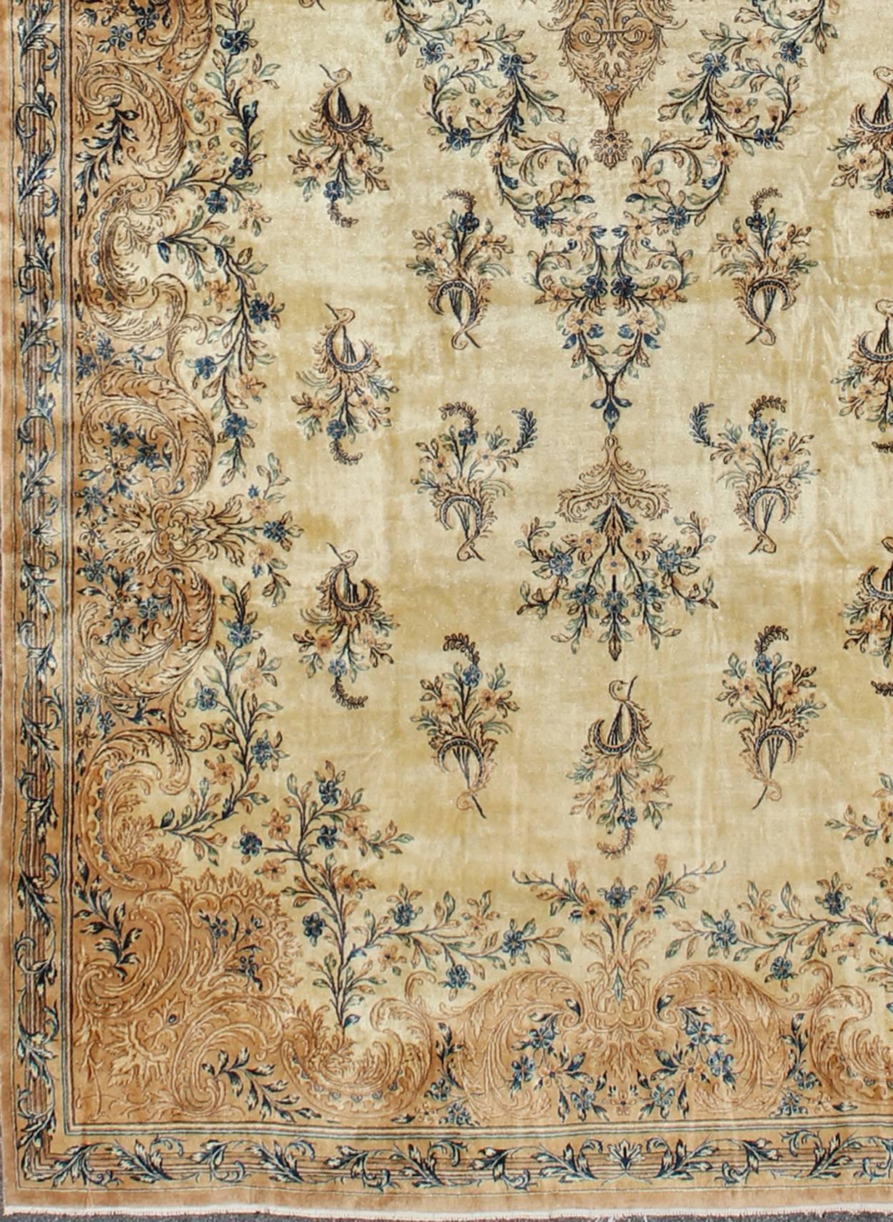 Antique Lavar Kerman rug with blossoming floral motifs in cream, tan and blue, rug dd-1, country of origin / type: Iran / Kerman, circa 1890

This Antique Lavar Kerman carpet from the late 19th century is remarkably crafted with a highly intricate