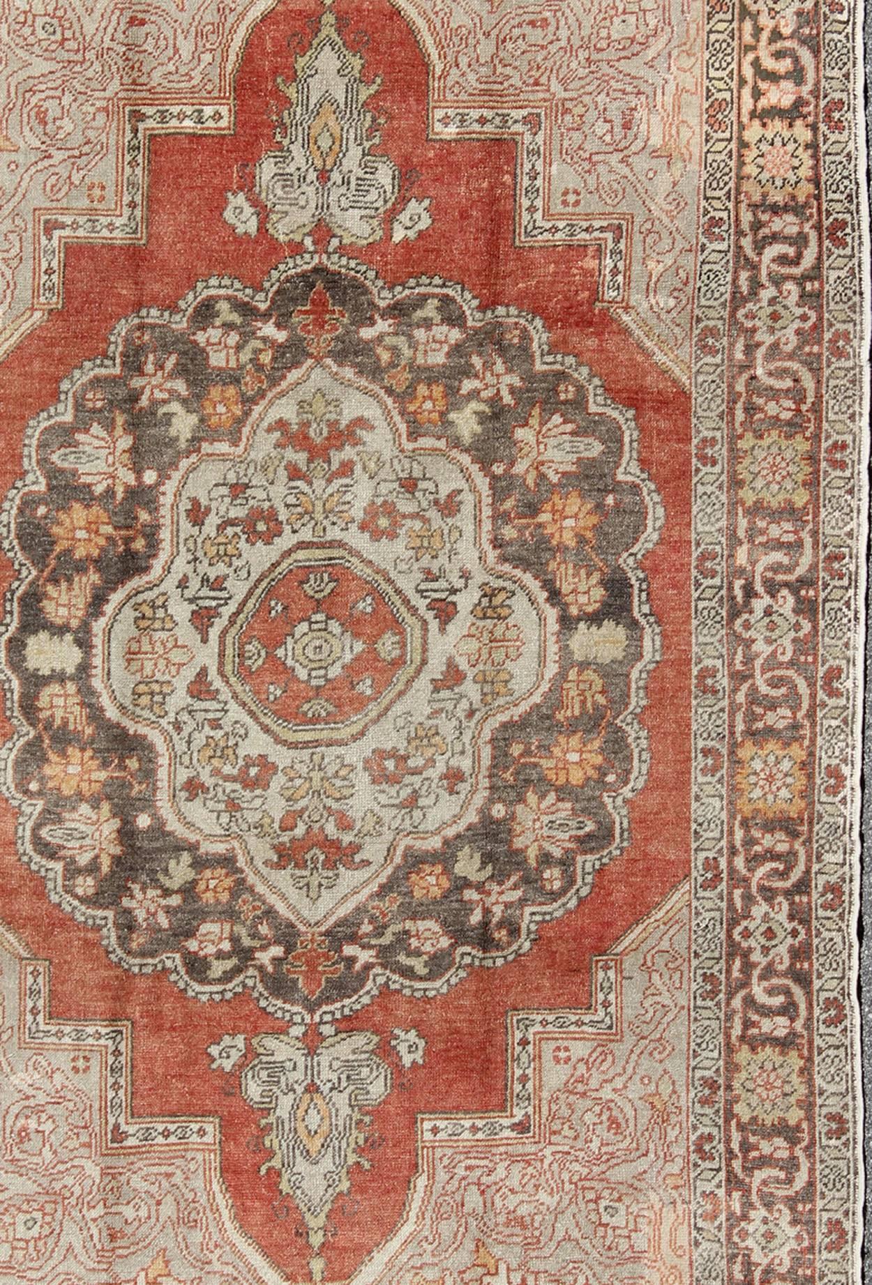 20th Century Antique Turkish Oushak Rug with Floral Medallion in Red, Charcoal and Cream For Sale