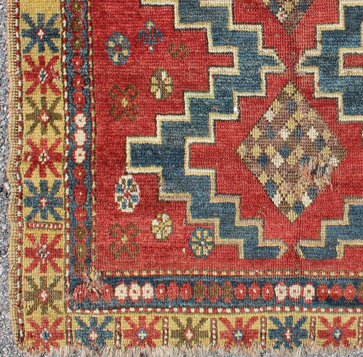 Square-Shaped Antique Caucasian Rug with Dual Medallions and Tribal Motifs, rug 16-0907, country of origin / type: Caucasus / Kazak, circa 1890

This square-shaped antique Caucasian carpet (circa 1890) features a central dual-medallion design, as