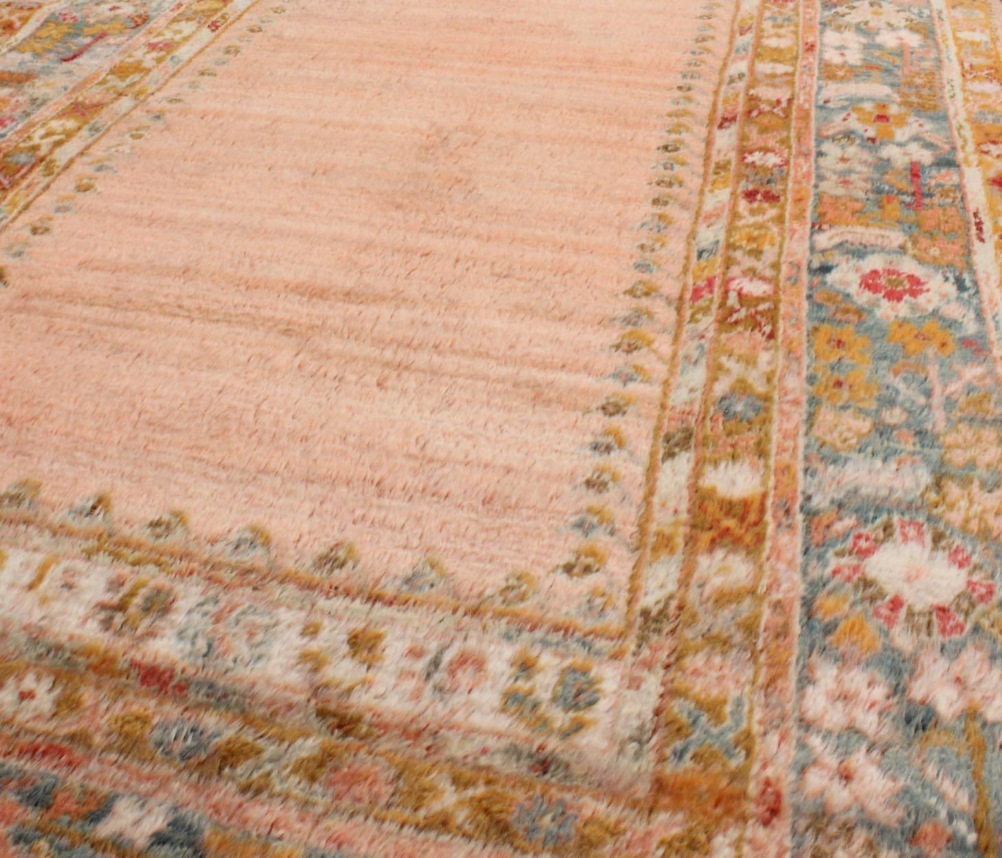 Hand-Knotted Antique Angora Wool Oushak Rug with Solid Salmon Field and Floral Borders For Sale