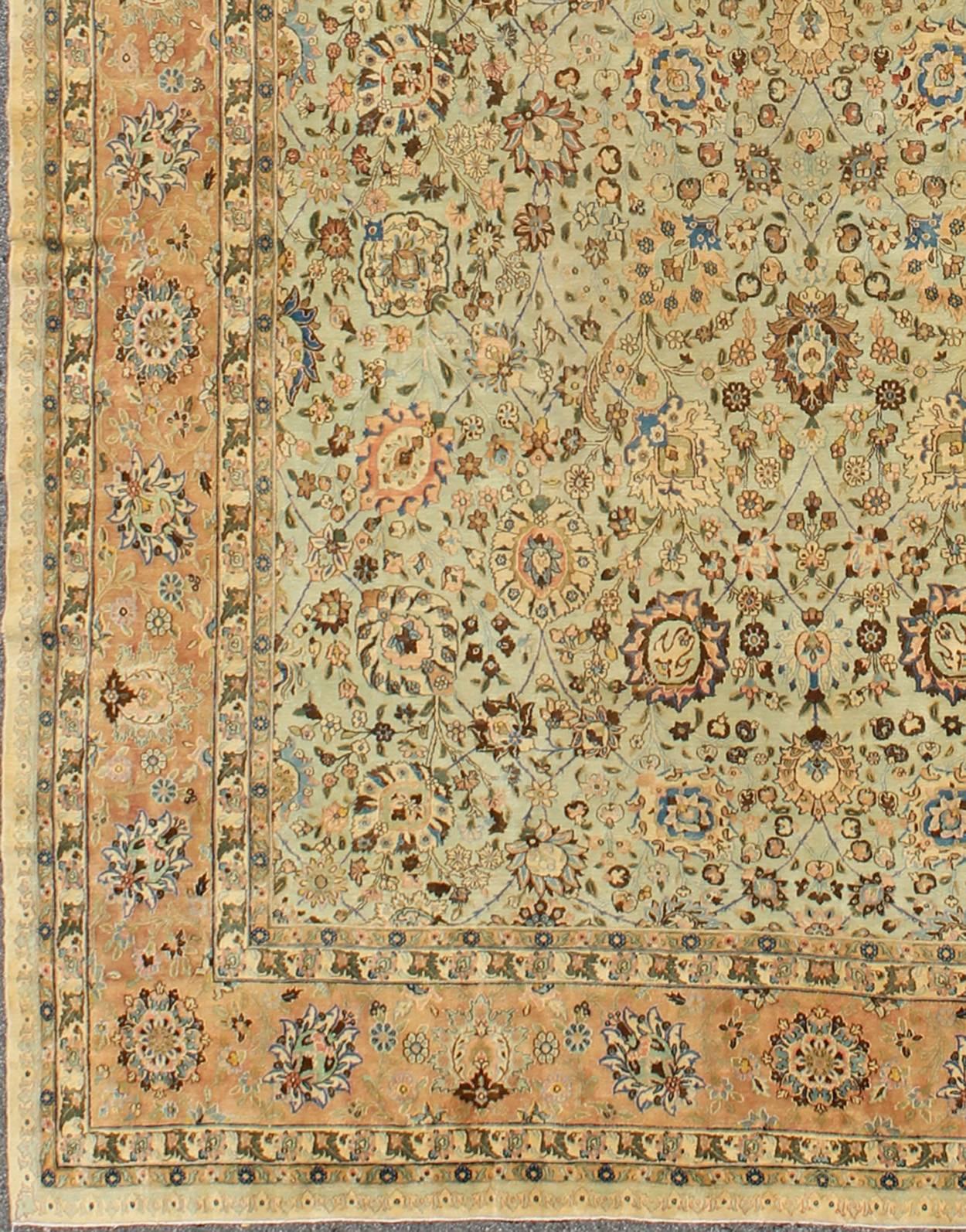 Antique Persian Tabriz Rug with Intricate Floral Design in Ivory and Salmon, rug bnc-100, country of origin / type: Iran / Tabriz, circa 1930

This vintage Persian Tabriz carpet (circa 1930) features a refined palate of ivory and salmon pink tones