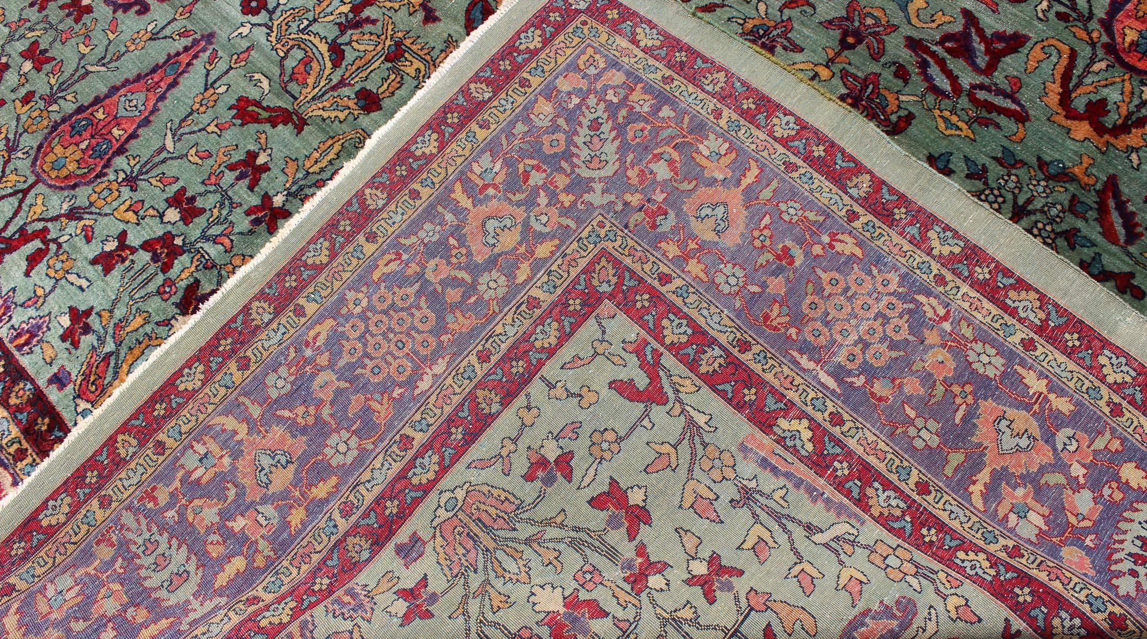 Early 20th Century Antique Agra Rug with Branching Floral Design in Mint Green, Purple and Burgundy For Sale