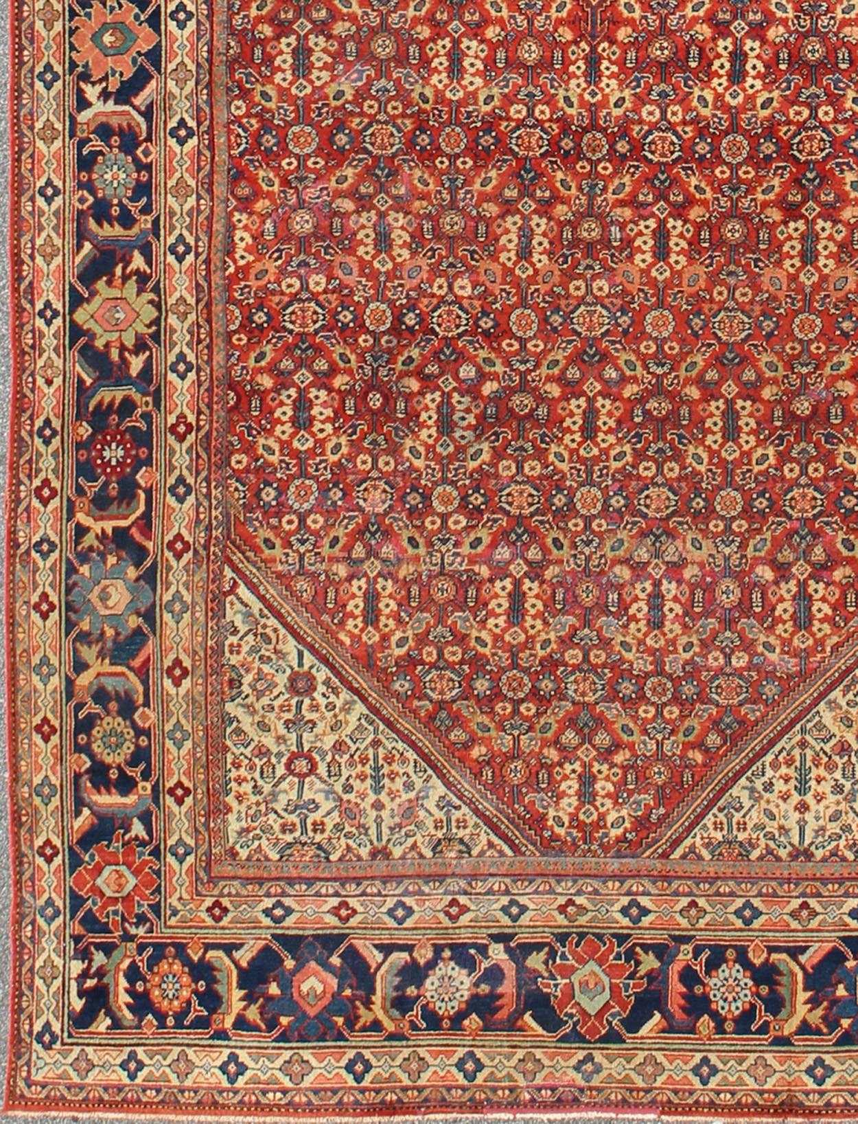 Antique Persian Sultanabad rug with Sub-geometric motifs with a Diamond Central Medallion.  rug E-0909, country of origin / type: Iran / Sultanabad, circa 1910.

This beautiful antique Persian Sultanabad carpet, handwoven in the early 20th century