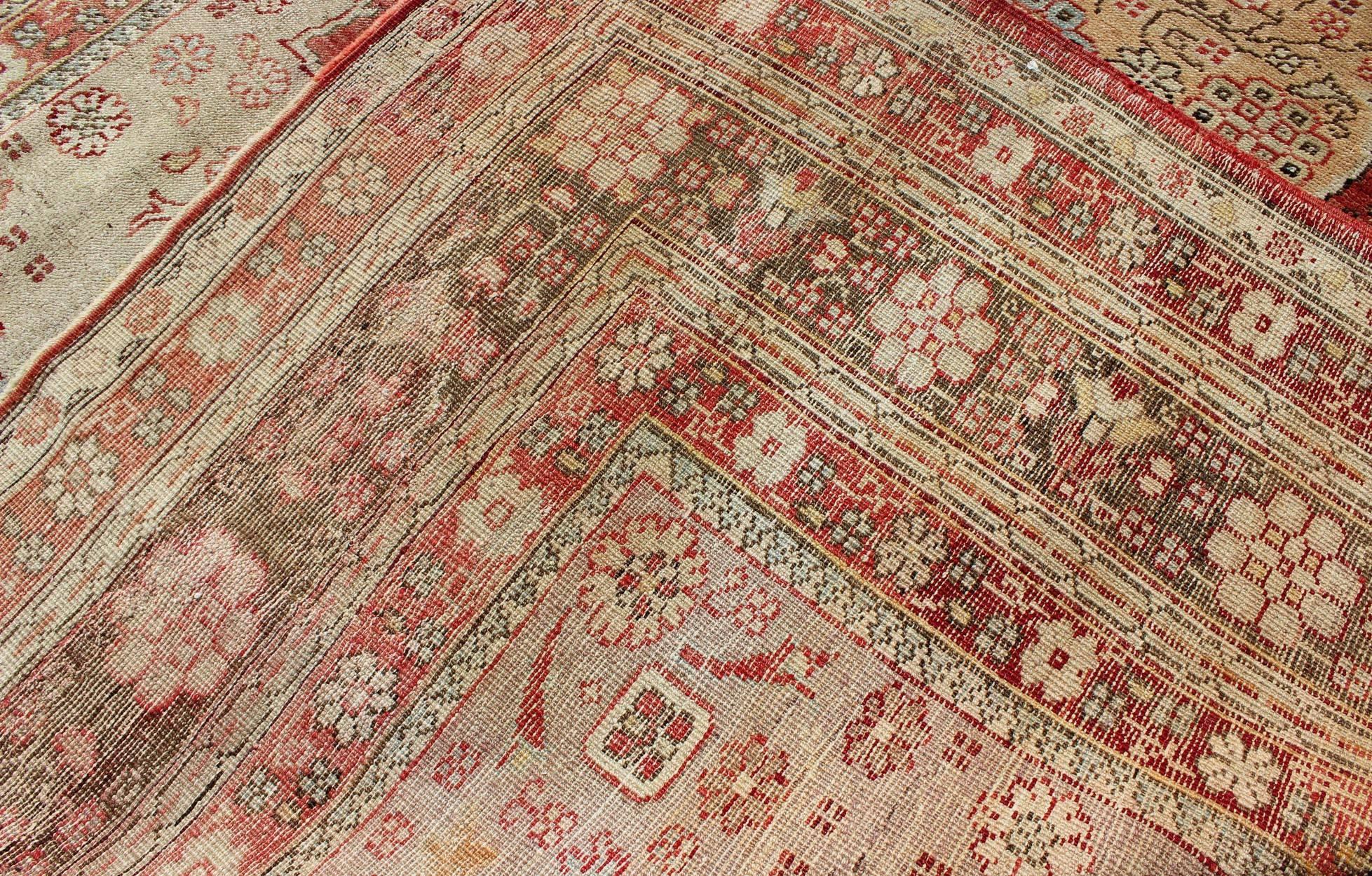 Wool Antique Oushak Rug in Soft Red, Brown and Tan For Sale
