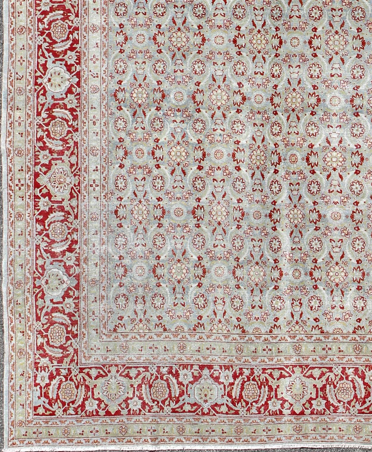 All-Over Floral Design Antique Persian Tabriz Rug in Shades of Gray-Blue and Red. Keivan Woven Arts / rug EMA-7513, country of origin / type: Iran / Tabriz, circa 1910
Measures: 11'2 x 14
This antique Persian Tabriz carpet (circa 1910) features both