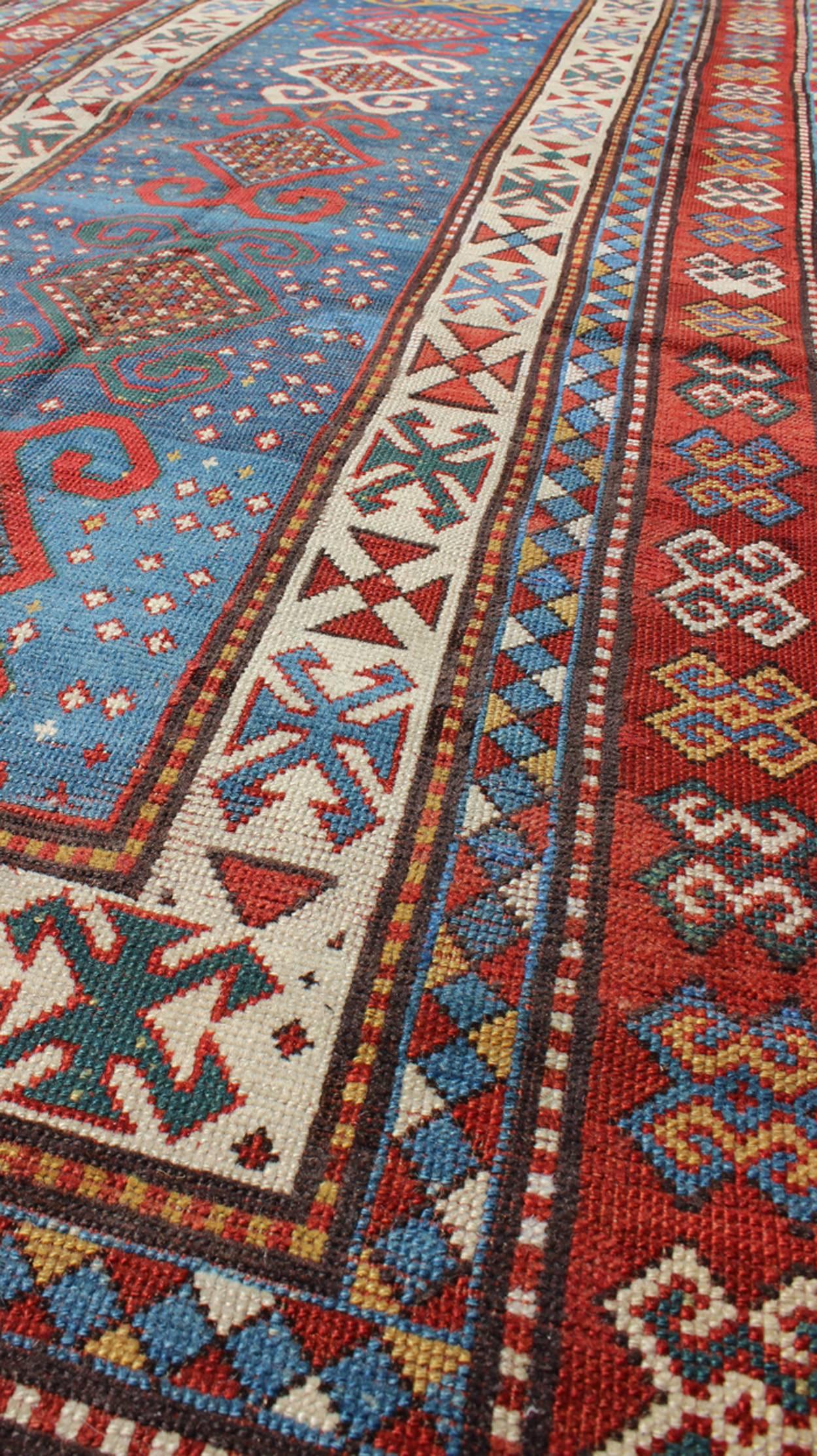 Persian Red and Blue Antique Caucasian Kazak Rug with Vertical Tribal Medallions For Sale