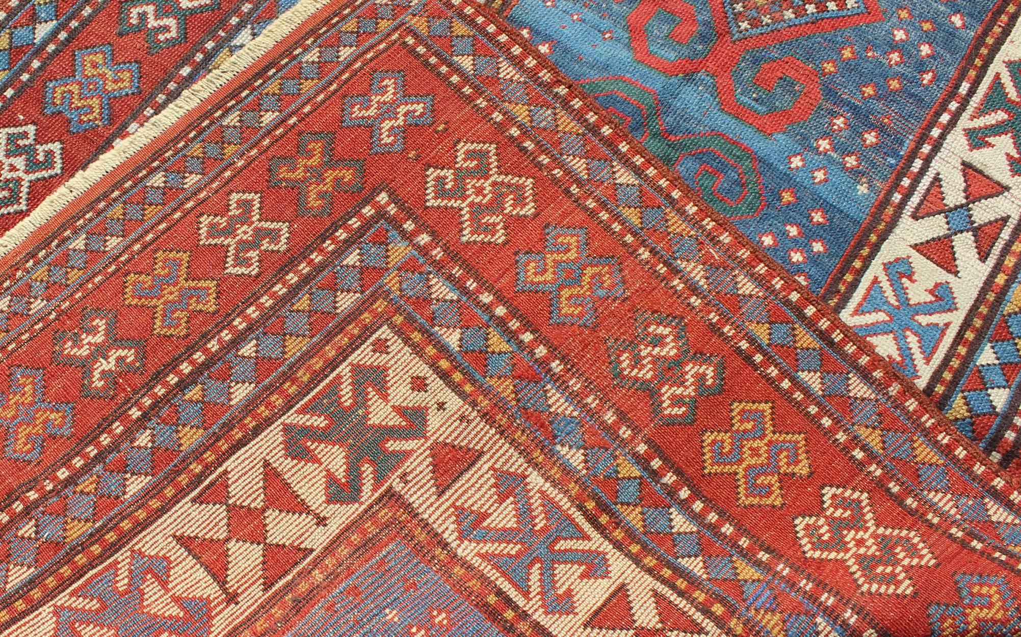 Red and Blue Antique Caucasian Kazak Rug with Vertical Tribal Medallions In Good Condition For Sale In Atlanta, GA