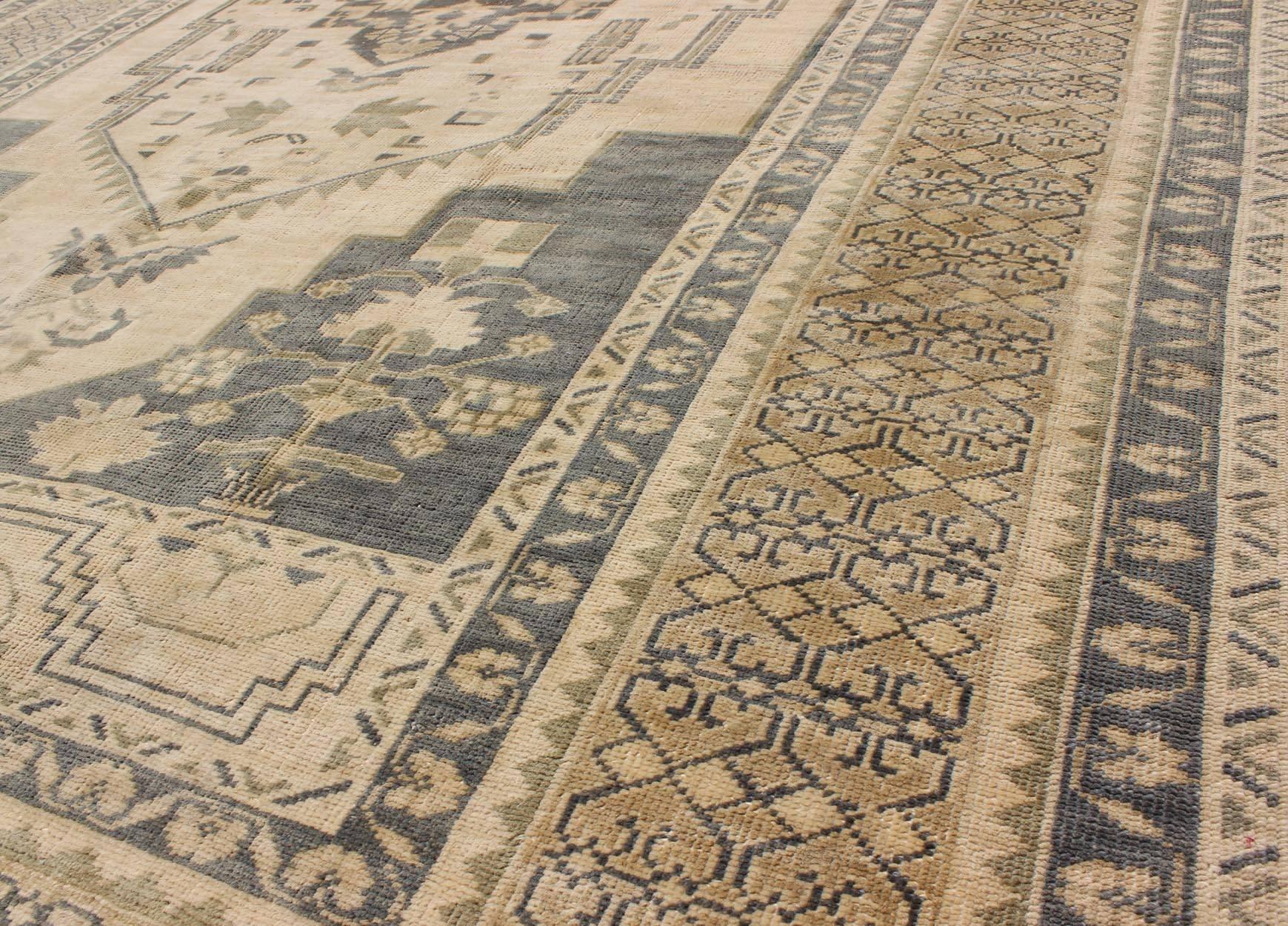 Wool Blue Gray and Cream Mid-20th Century Turkish Oushak Rug with Medallion, Cornices