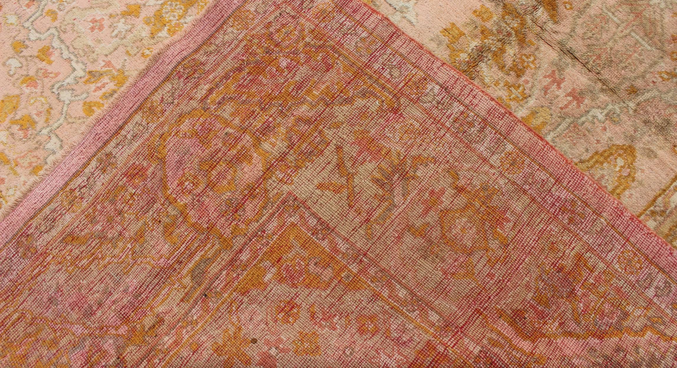 Wool Antique Oushak Rug with Floral Pattern in Pink, Orange and Light Green  For Sale