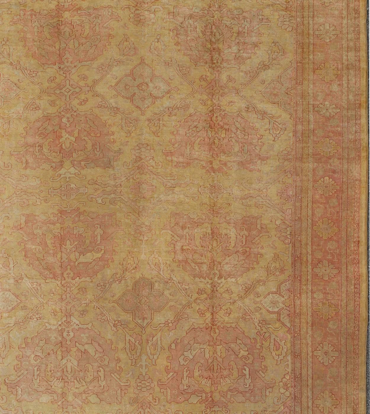 Antique Turkish Oushak Rug with Large Floral Motifs in Cream Yellow, Muted Coral In Good Condition For Sale In Atlanta, GA