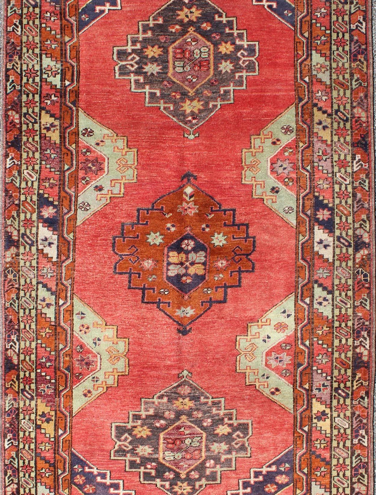 Hand-Knotted Red Field Vintage Turkish Oushak Rug with Vertical Geometric Medallions For Sale