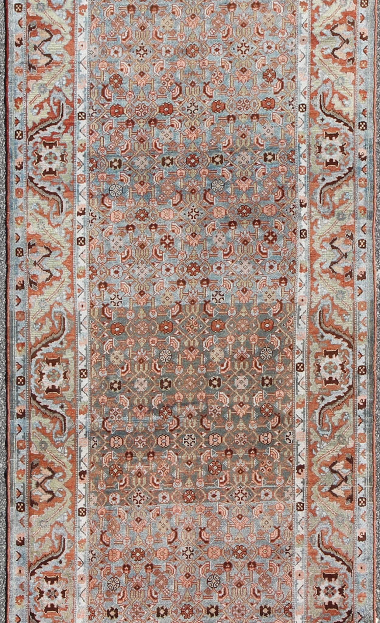 Multicolored Antique Persian Malayer Runner with Blue Background, Floral Motifs In Excellent Condition In Atlanta, GA