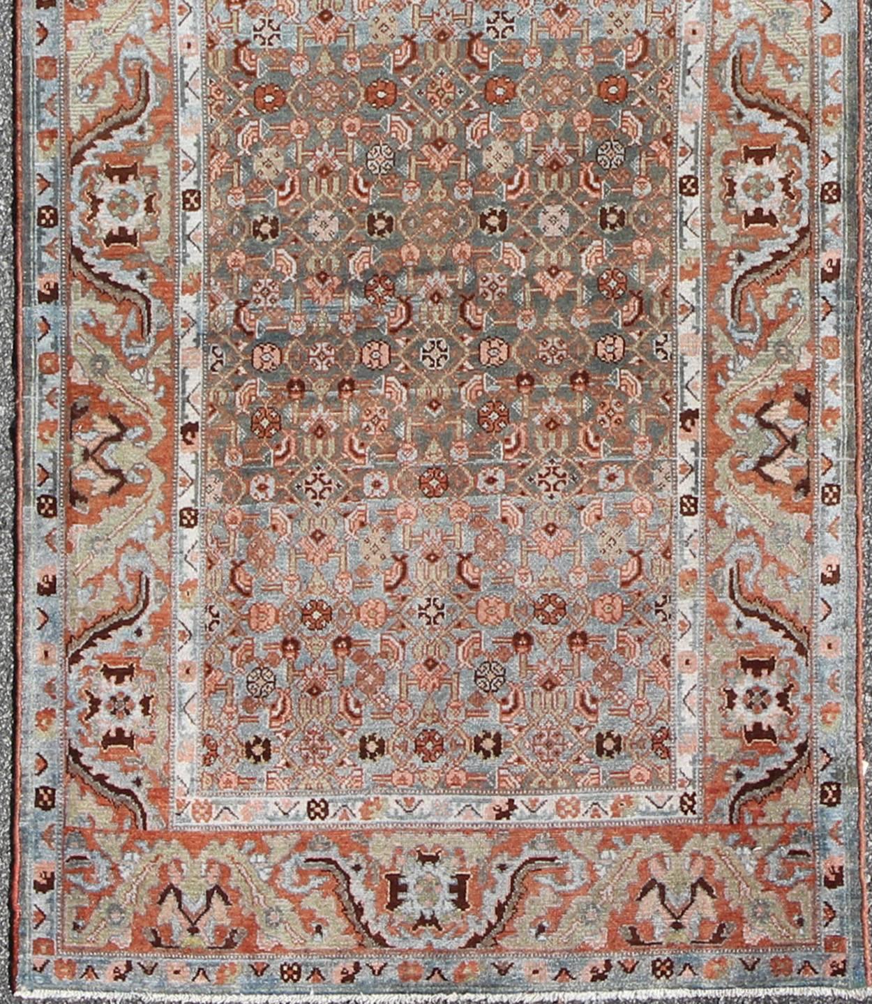 Multicolored antique Persian Malayer runner with blue background, floral motifs, rug ema-7507, country of origin / type: Iran / Malayer, circa 1910

This Persian Malayer runner from early 20th century Iran features an all-over sub-geometric floral