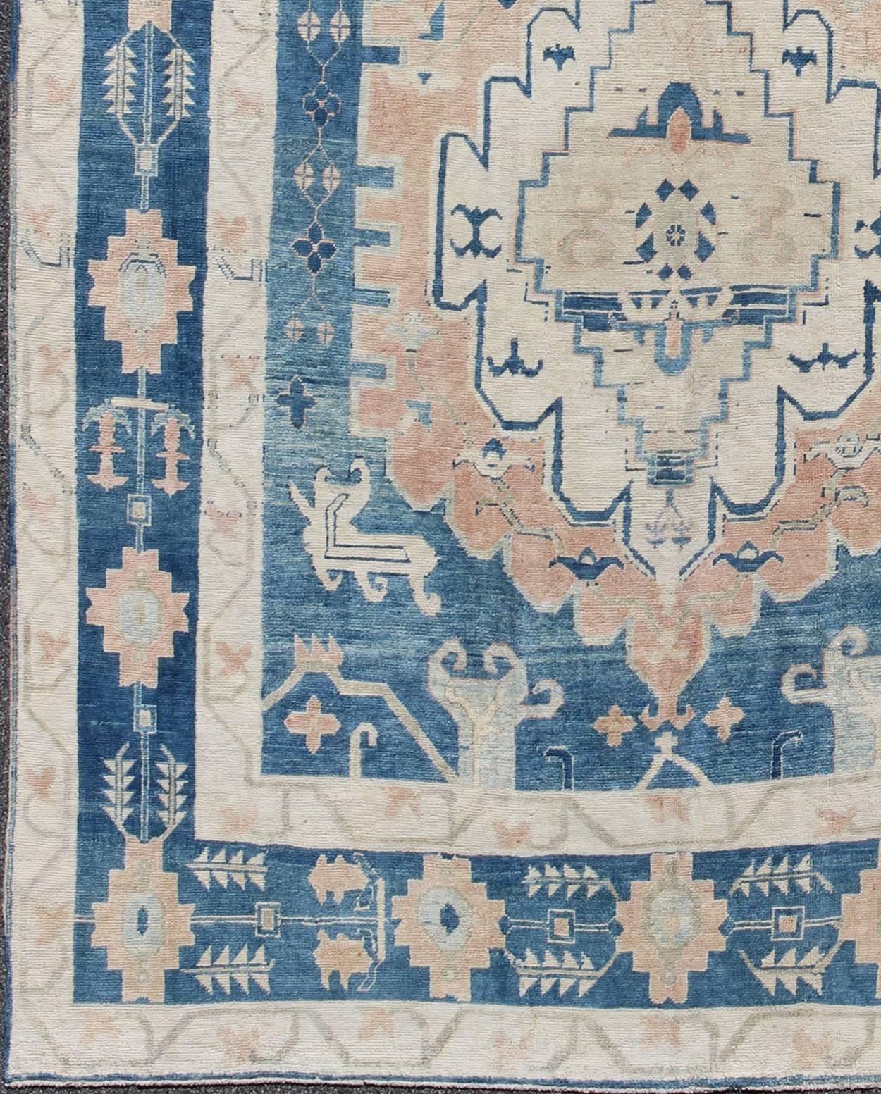 Blue and Salmon Vintage Turkish Oushak Rug with Layered Medallion and Motifs. Keivan Woven Arts /  rug / EN-165189, country of origin / type: Turkey / Oushak, Mid-20th century. 
Measures: 9'11 x 11'8.
This beautiful vintage rug from mid-20th century
