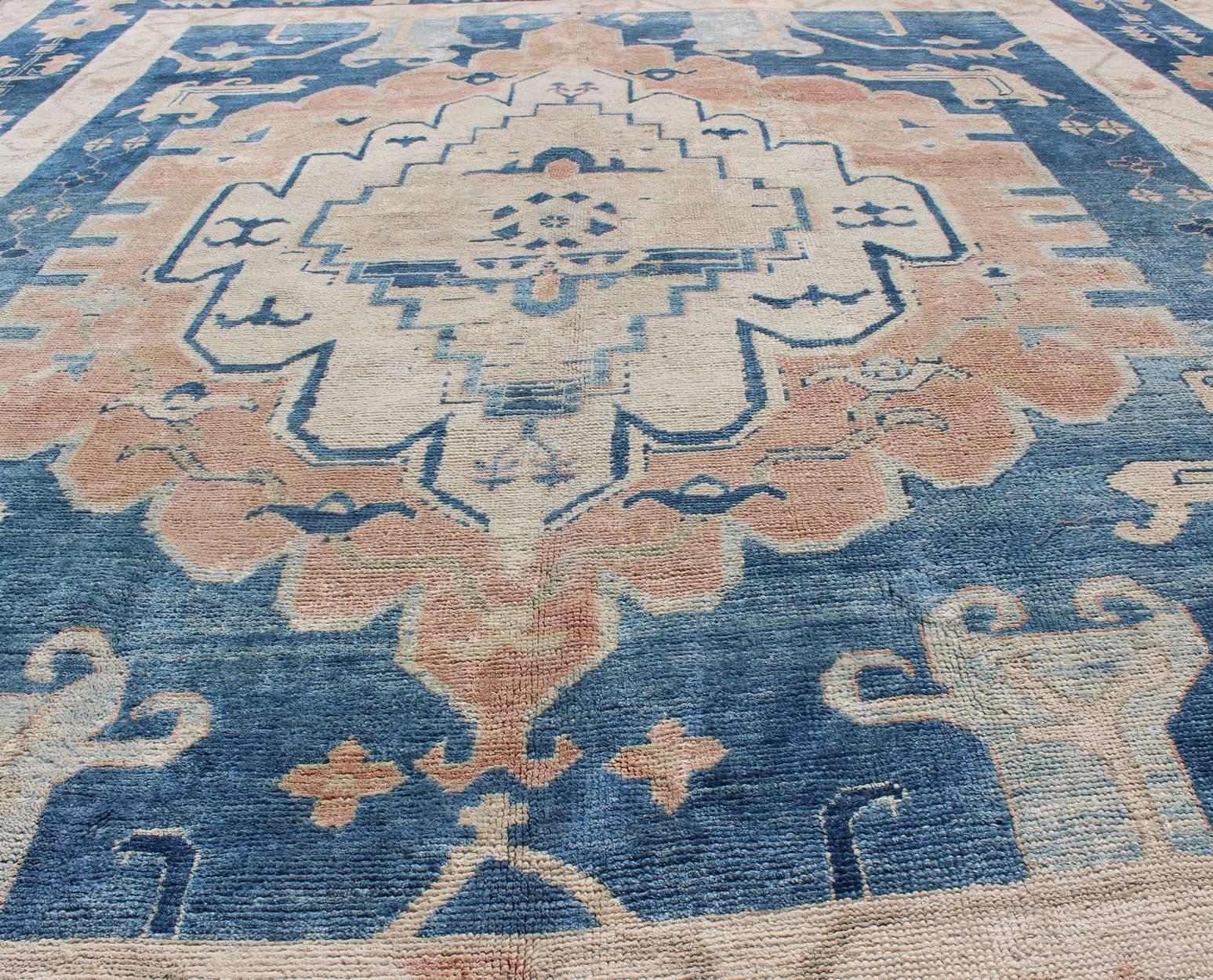 Hand-Knotted Blue and Salmon Vintage Turkish Oushak Rug with Layered Medallion and Motifs  For Sale
