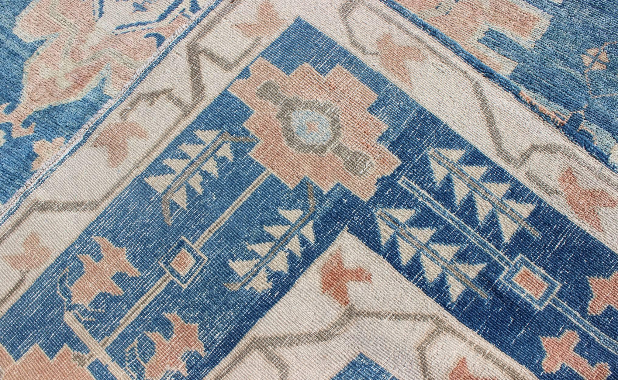 Blue and Salmon Vintage Turkish Oushak Rug with Layered Medallion and Motifs  In Good Condition For Sale In Atlanta, GA