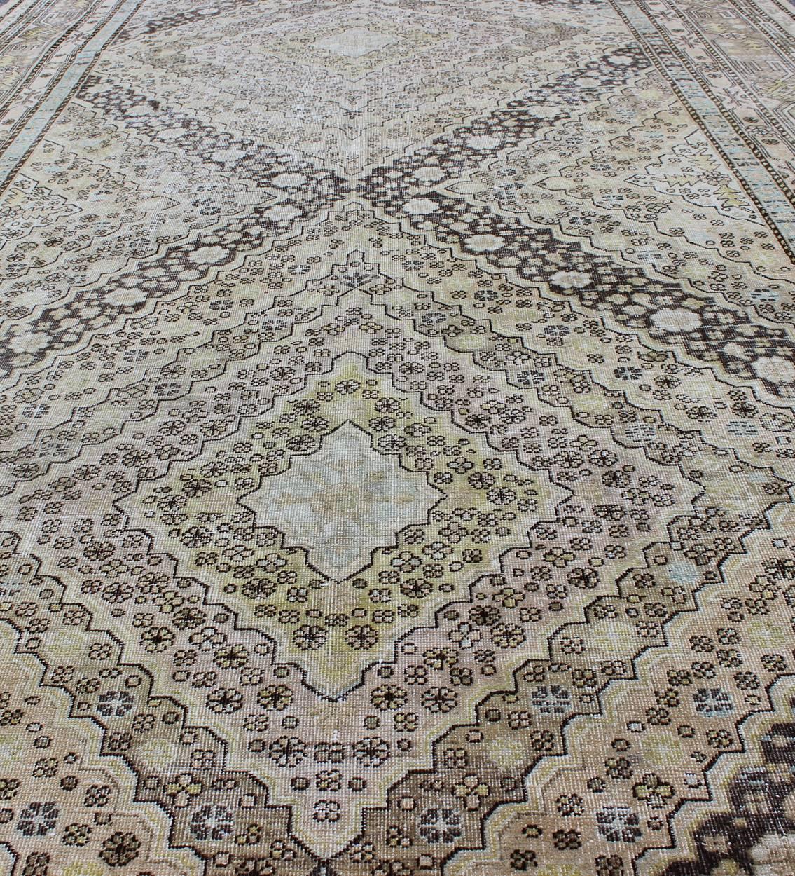 Wool Antique Turkestanian Khotan Rug with Paired Diamond Geometric Medallions For Sale