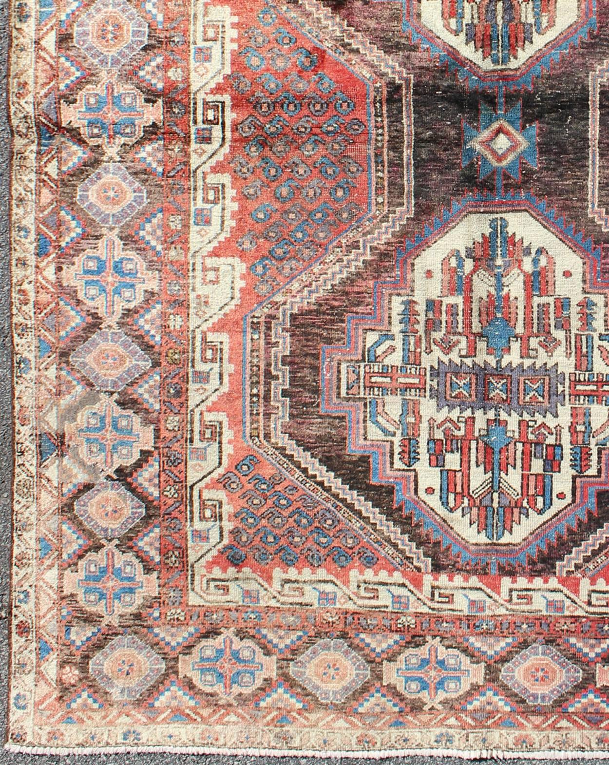 Dual medallion vintage Persian Seejan rug in red, charcoal, blue, and brown, rug tu-9902, country of origin / type: Iran / Seejan, circa mid-20th century

This vibrant Turkish Oushak carpet features a central Dual-medallion design, as well as
