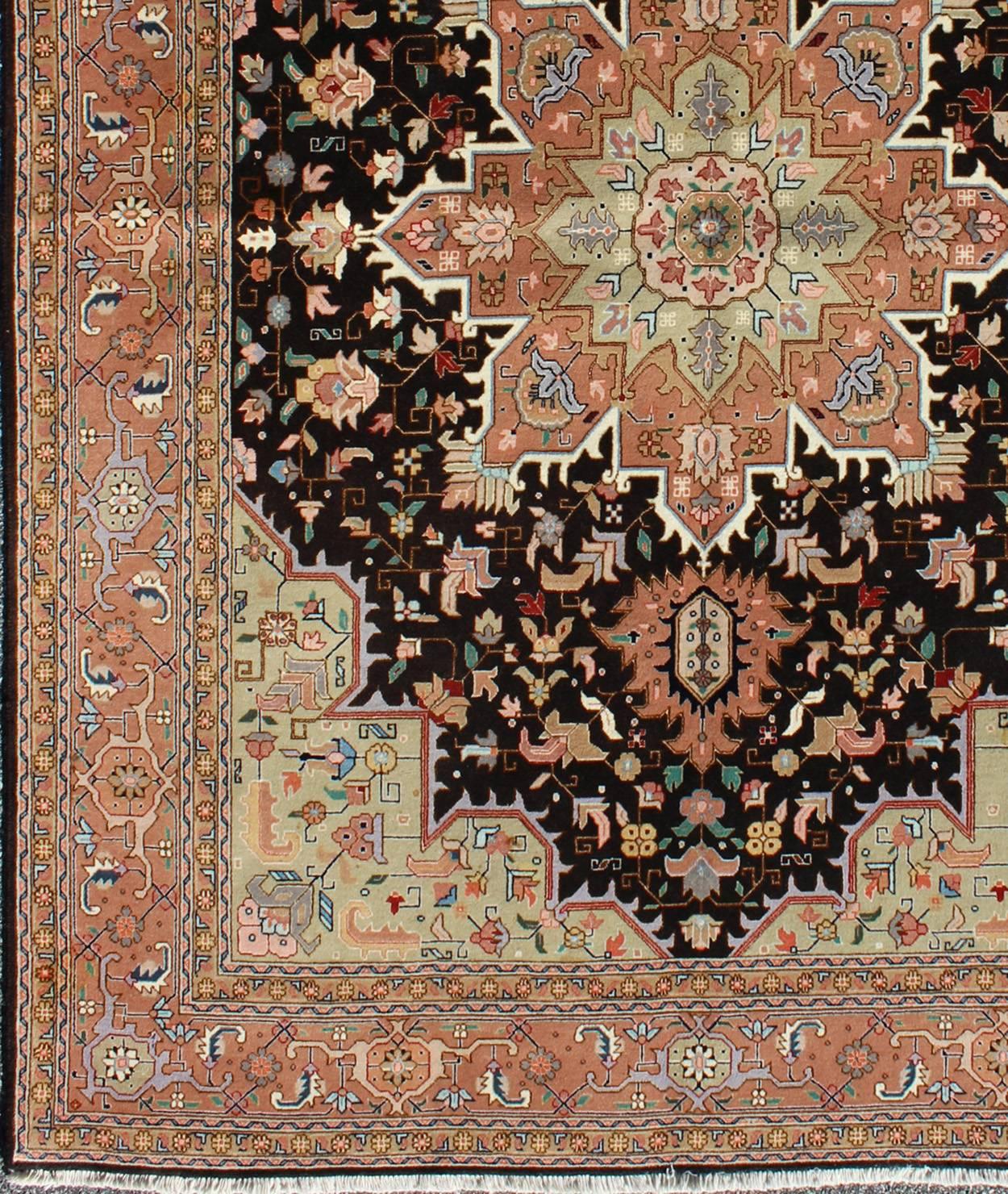 Black background Persian vintage Tabriz carpet with intricate floral elements, rug lok-1176, country of origin / type: Iran / Tabriz, circa 1970

This outstanding antique Persian Tabriz carpet (circa late 20th century) is primarily characterized