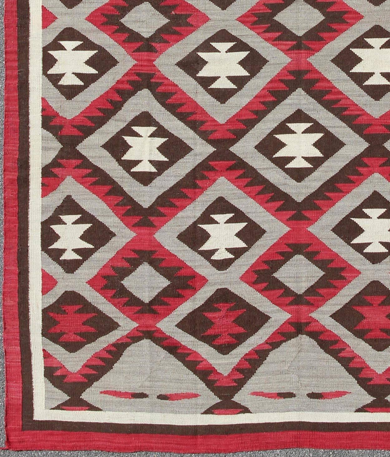 Contemporary American Navajo rug with latticework tribal design in red and gray, rug rsc-50668-ar-108, country of origin / type: North America / Navajo, circa early 21st century

This intriguing contemporary Navajo rug was woven in the United