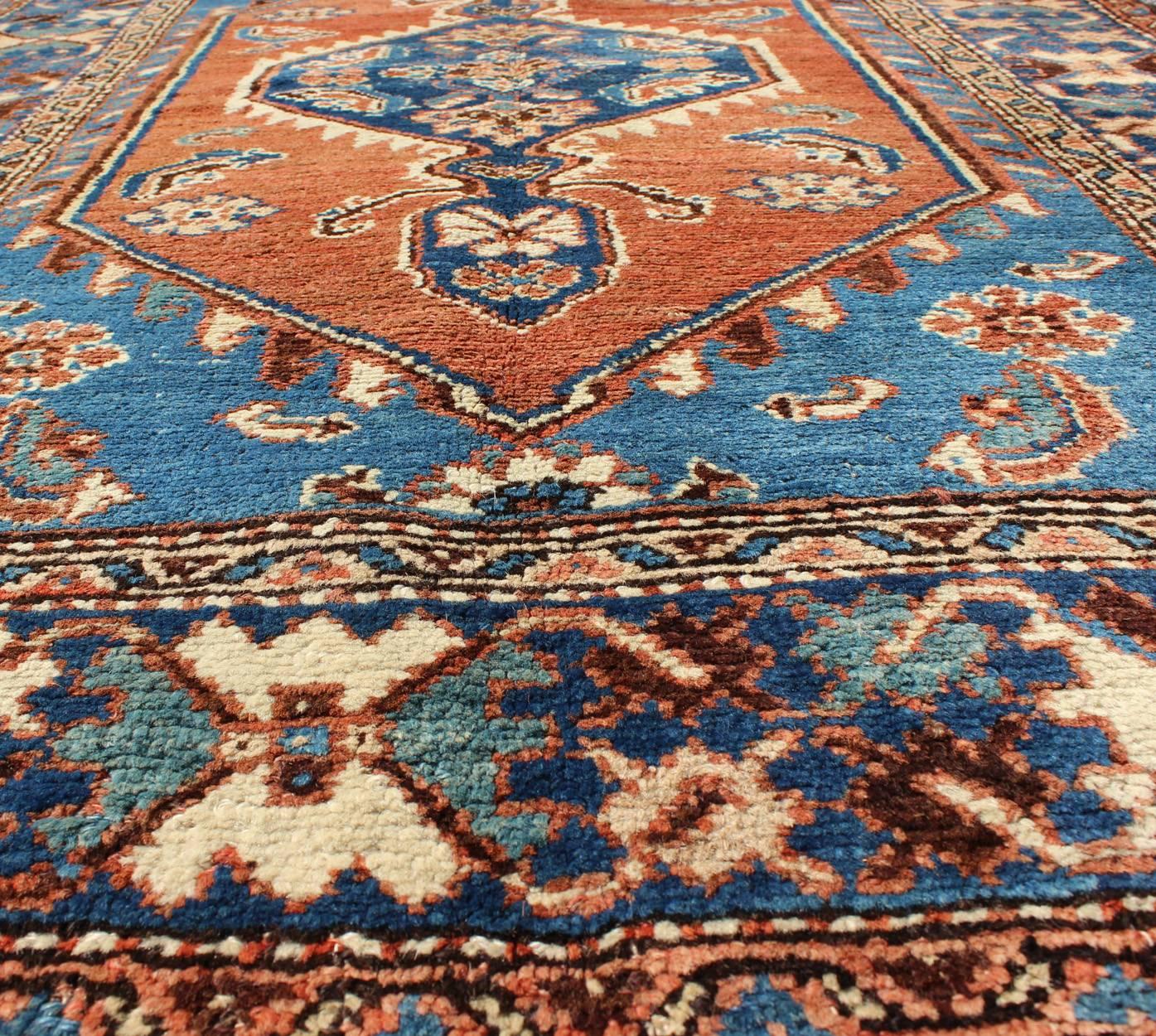 Hand-Knotted Antique Persian Karadjeh Rug with Tribal Medallion in Rust Red and Bright Blue For Sale