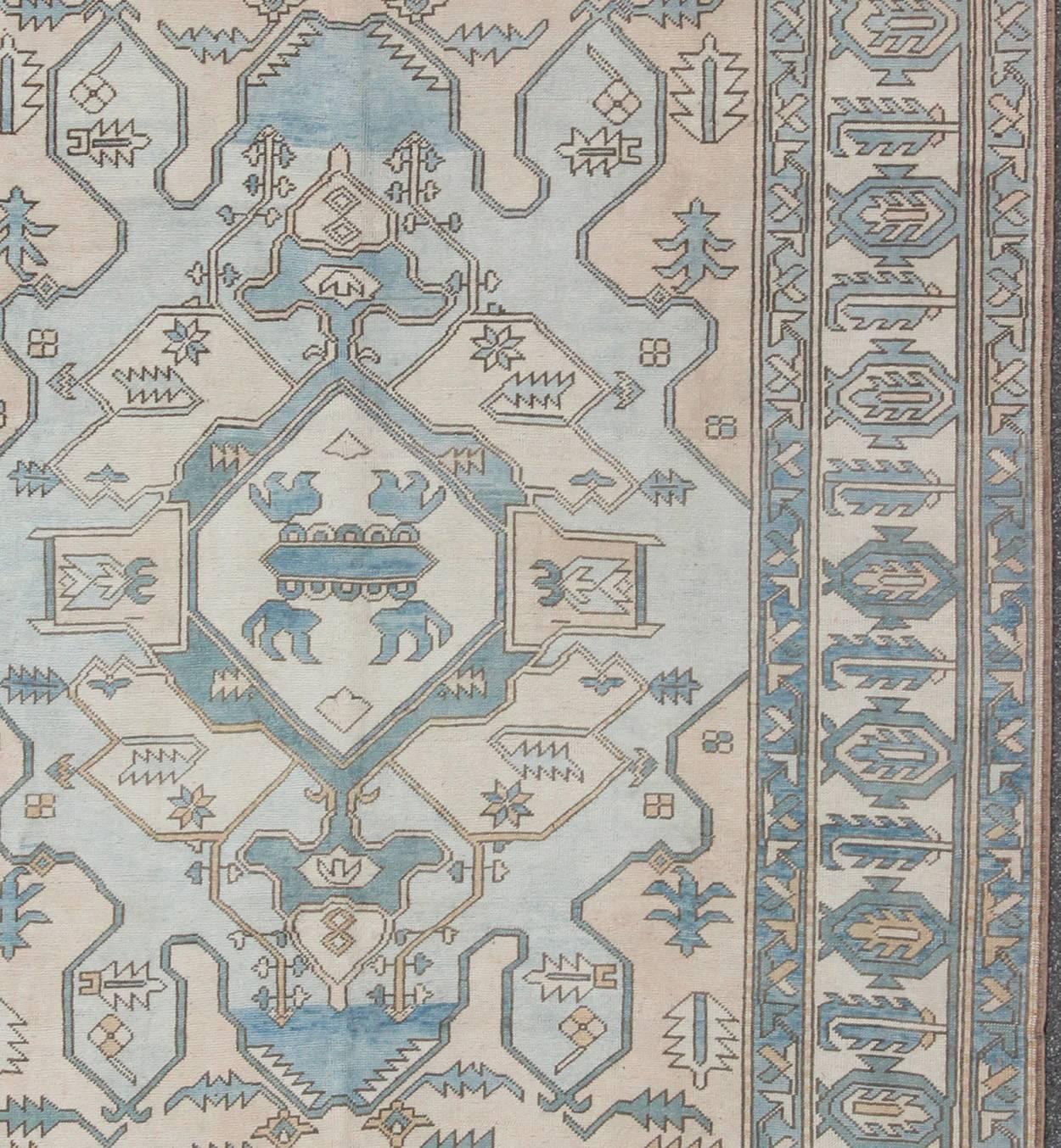 Hand-Knotted Vintage Oushak Rug from Turkey with Medallion in Shades of Blue, Cream and Nude