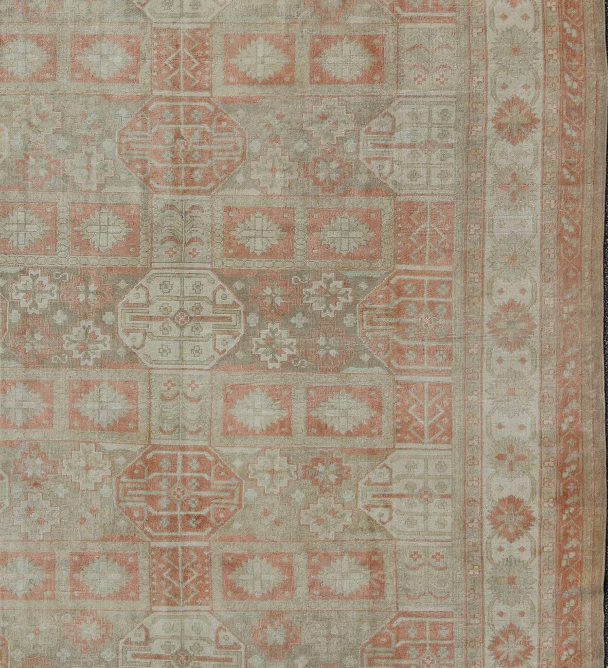 Hand-Knotted Vintage Khotan Design Rug with Sub-Geometric Grid Design and Detailed Borders For Sale