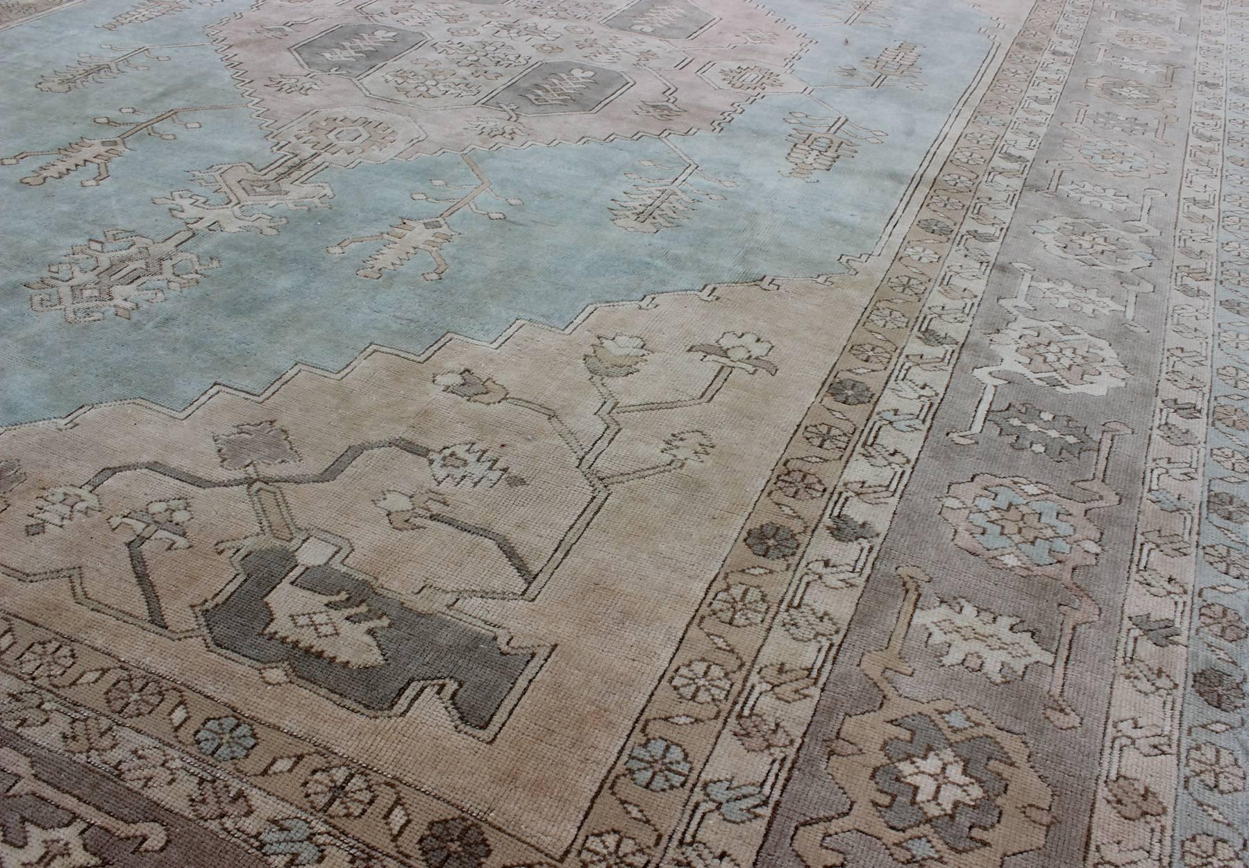 Mid-20th Century Vintage Turkish Oushak Rug with Vining Florals in Light Blue, Light Brown & Tan For Sale