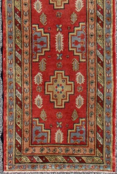 Antique Khotan Runner from Turkestan with Geometric Medallions in Red Background