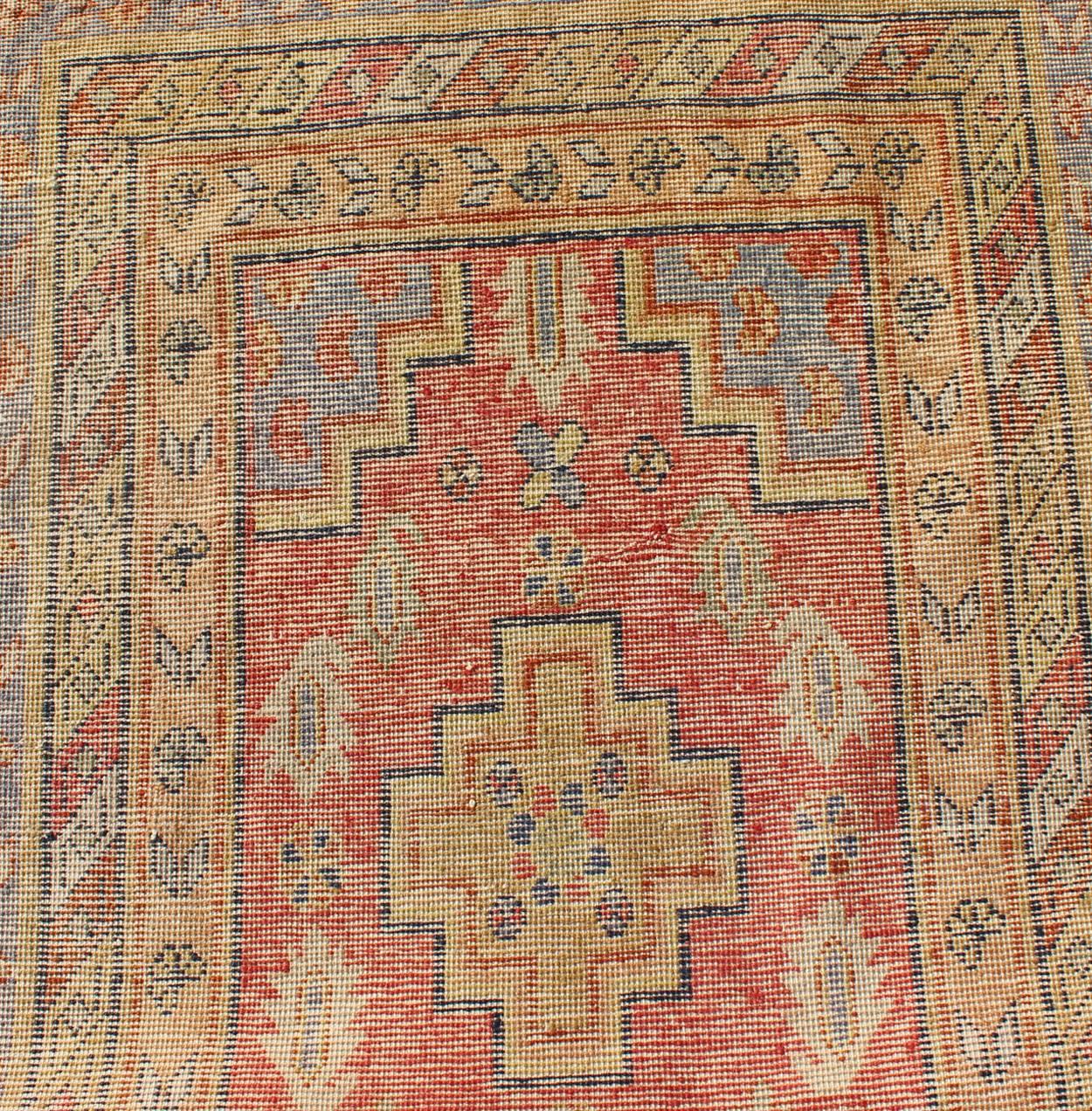 Antique Khotan Runner from Turkestan with Geometric Medallions in Red Background For Sale 1
