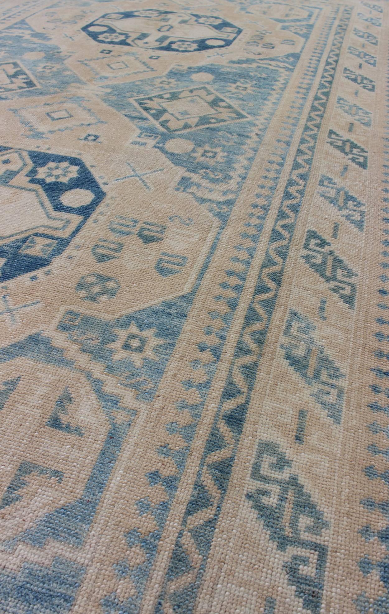 Mid-20th Century Blue and Tan Vintage Turkish Oushak Rug with Geometric Dual Medallions For Sale