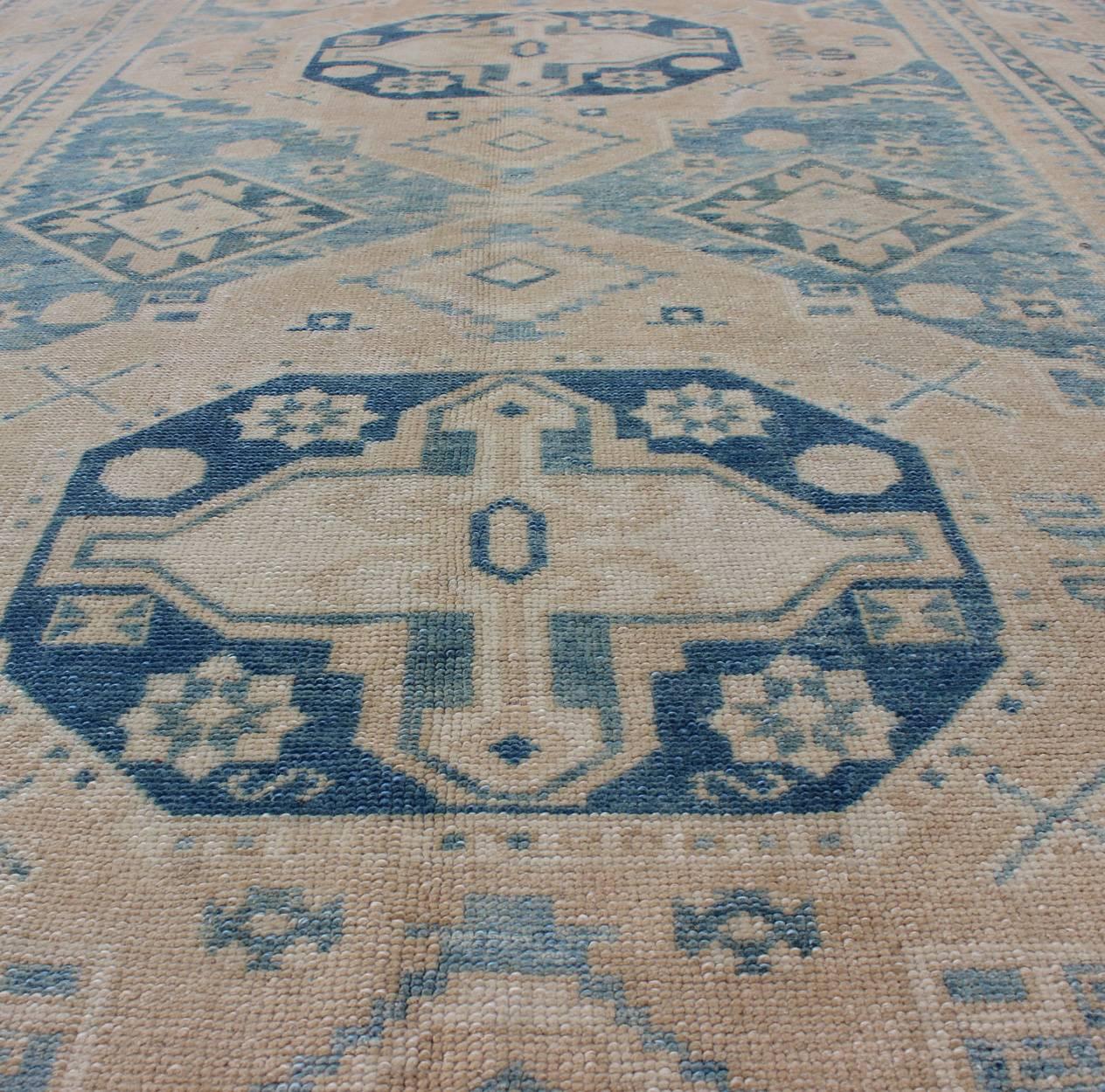 Wool Blue and Tan Vintage Turkish Oushak Rug with Geometric Dual Medallions For Sale
