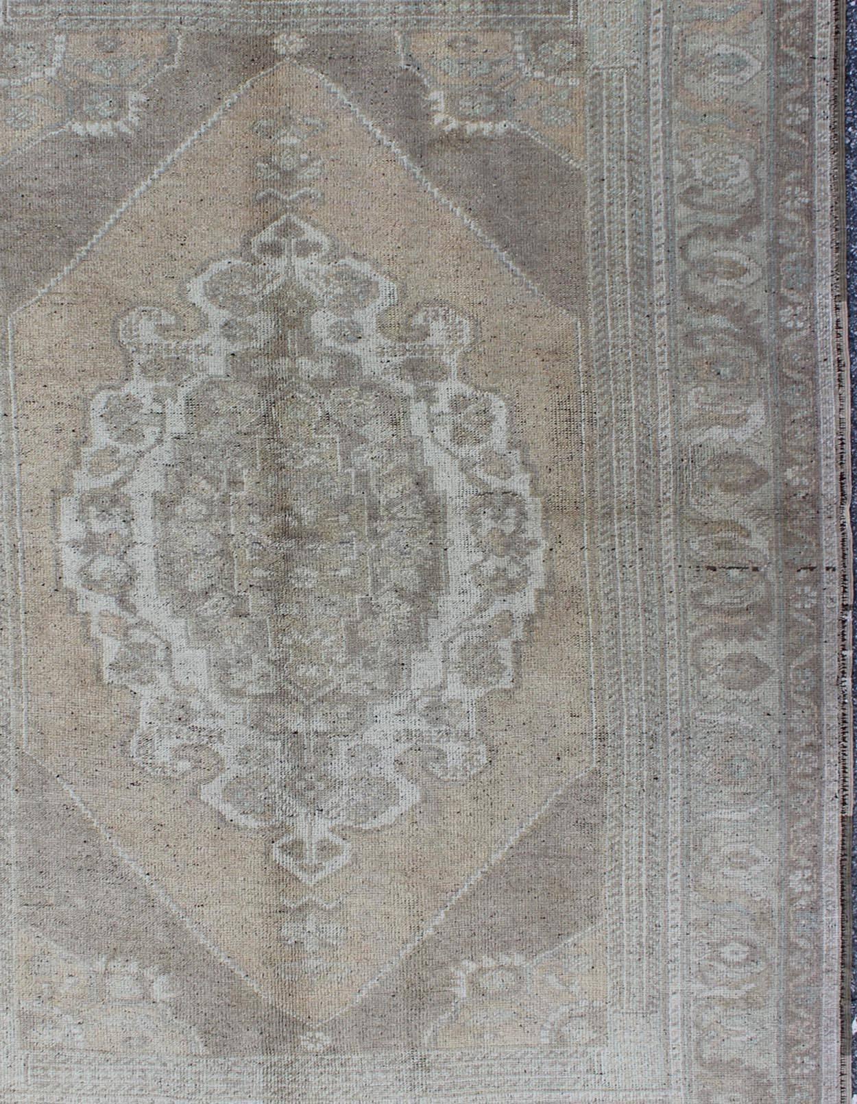 Mid-20th Century Muted Colors Vintage Turkish Oushak Rug with Medallion Design in Lt. Green For Sale