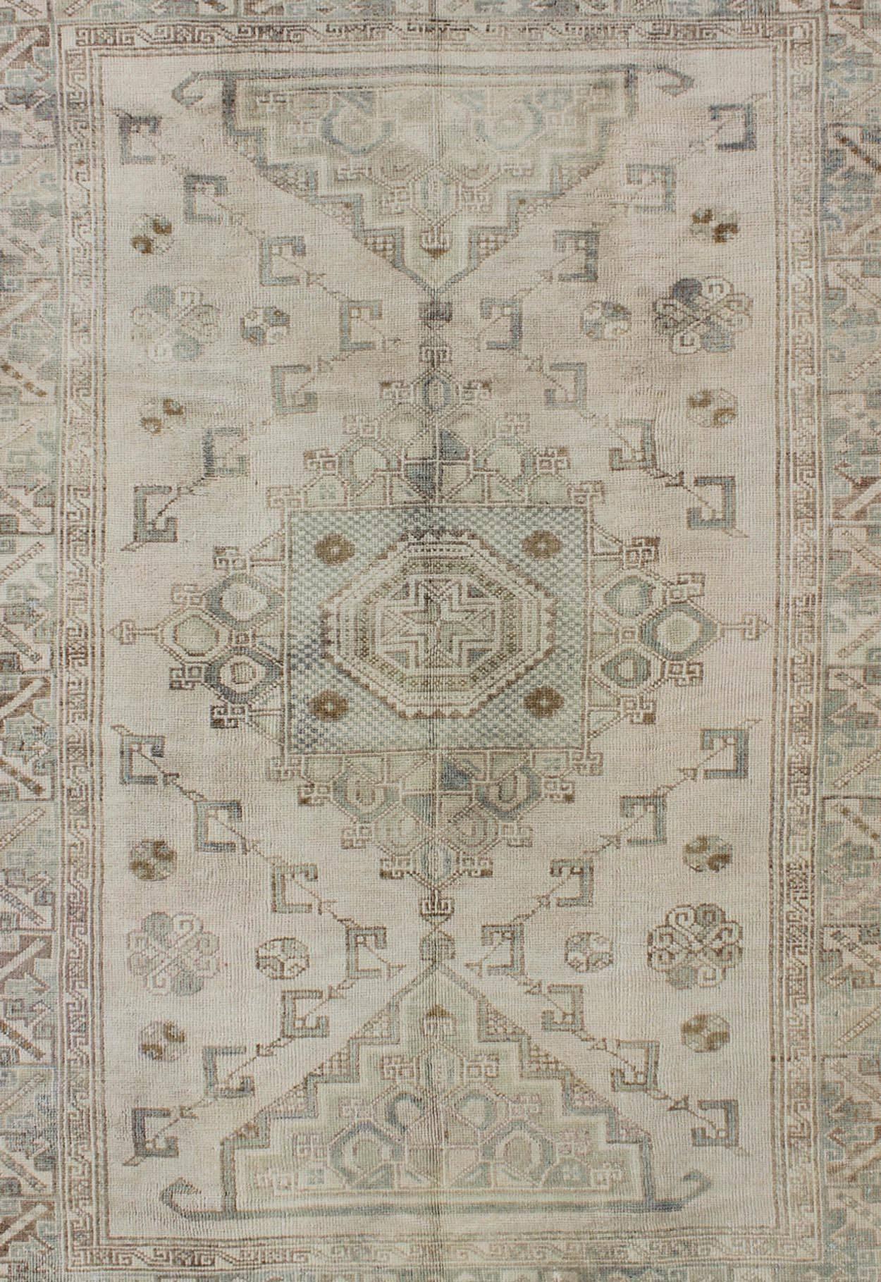 Hand-Knotted Medallion Vintage Turkish Oushak Rug with Soft Color Palette and Muted Tones