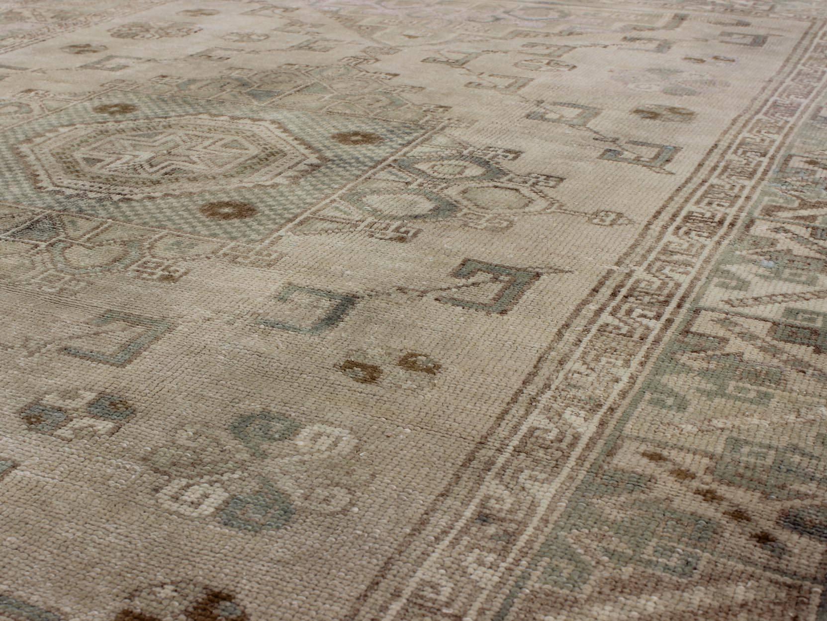 20th Century Medallion Vintage Turkish Oushak Rug with Soft Color Palette and Muted Tones