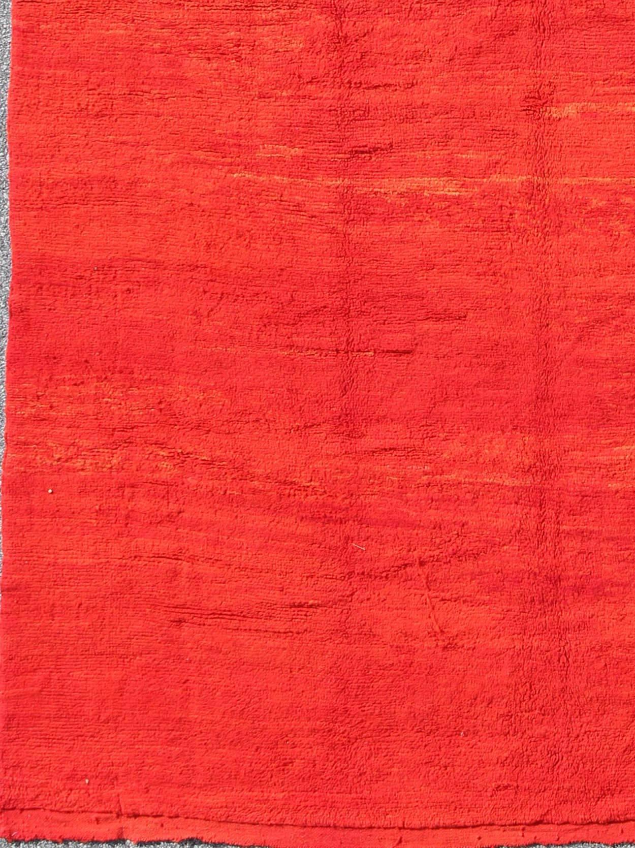 Mid-20th century vintage Moroccan rug with solid variegated red background, rug bds-k423, country of origin / type: Morocco / Tribal, circa 1950

This lovely mid-century vintage Moroccan rug displays a multitude of red and orange tones that vary