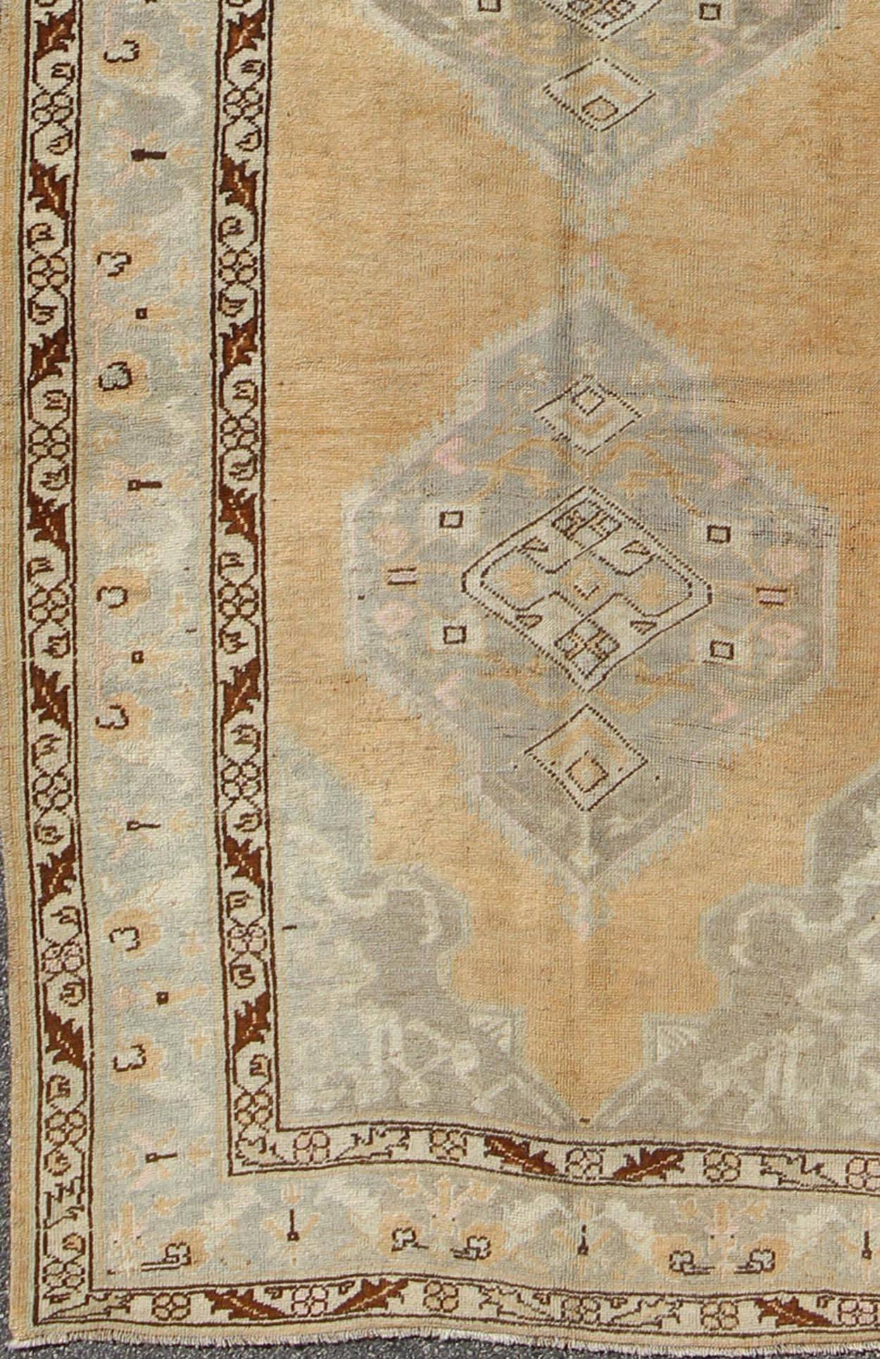  Gallery Size Vintage Turkish Oushak Runner With Medallions in Taupe, Brown, Peach, Light Green . Keivan Woven Arts/ rug/ En-92478, country of origin / type: Turkey / Oushak, circa 1940

Measures: 5'2 x 12'3

This vintage Turkish Oushak gallery