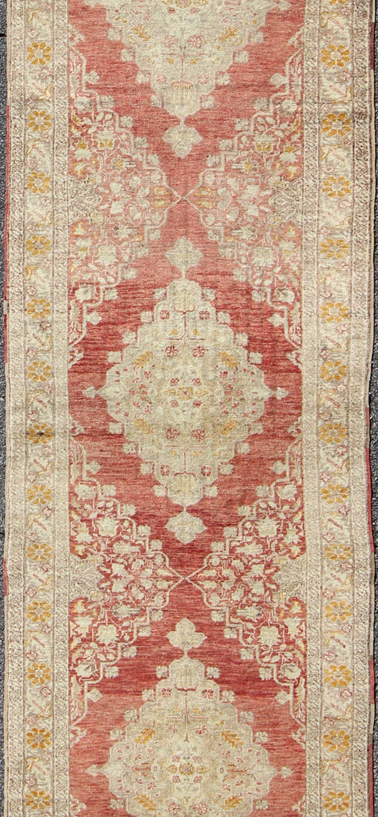 Hand-Knotted Antique Turkish Oushak Runner with Red Background and Ivory/Cream Medallions For Sale