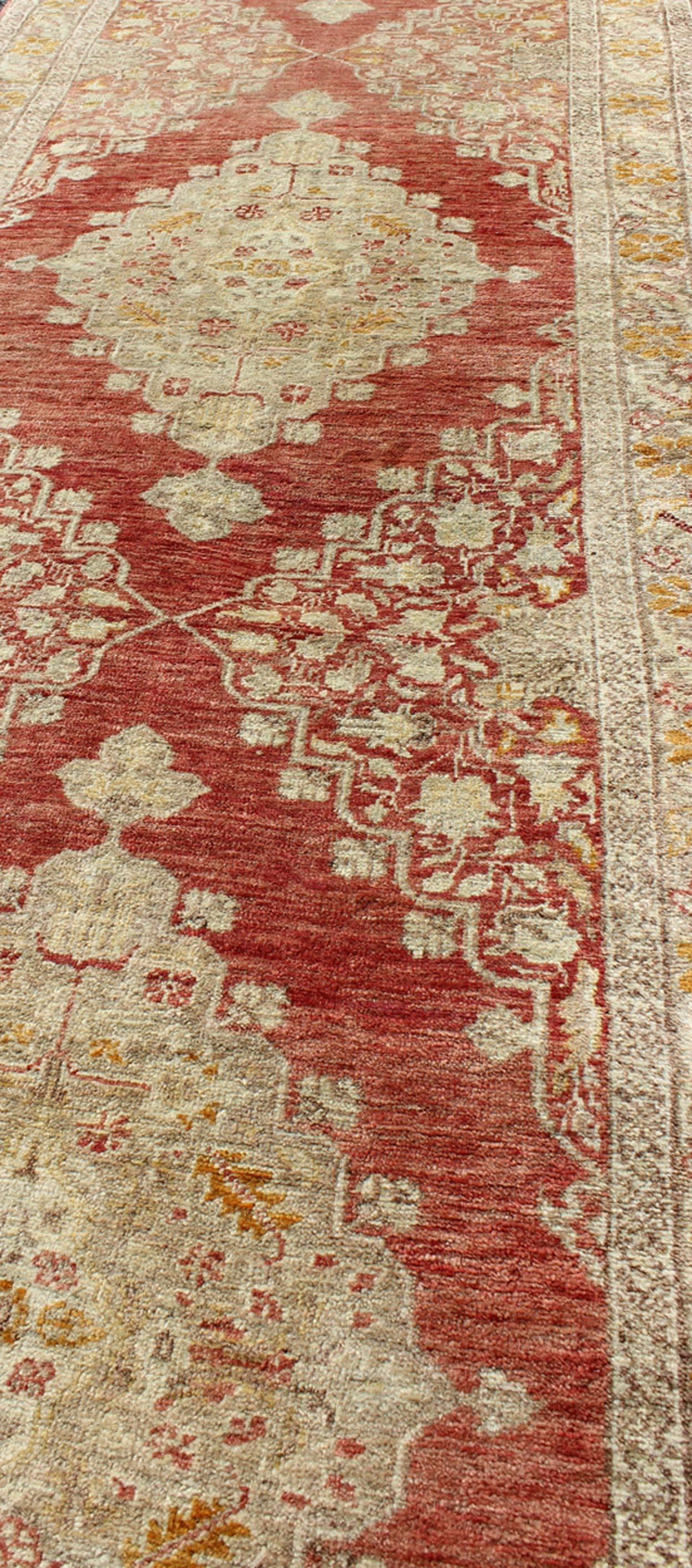 Early 20th Century Antique Turkish Oushak Runner with Red Background and Ivory/Cream Medallions For Sale